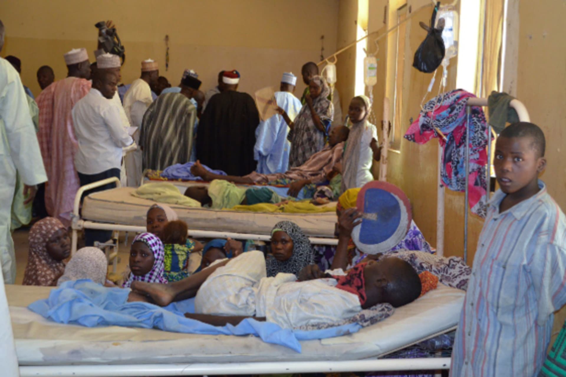 Residents, who were injured during an attack by Boko Haram militants, wait at the Bama General Hospital in Bama, Borno State, February 20, 2014.