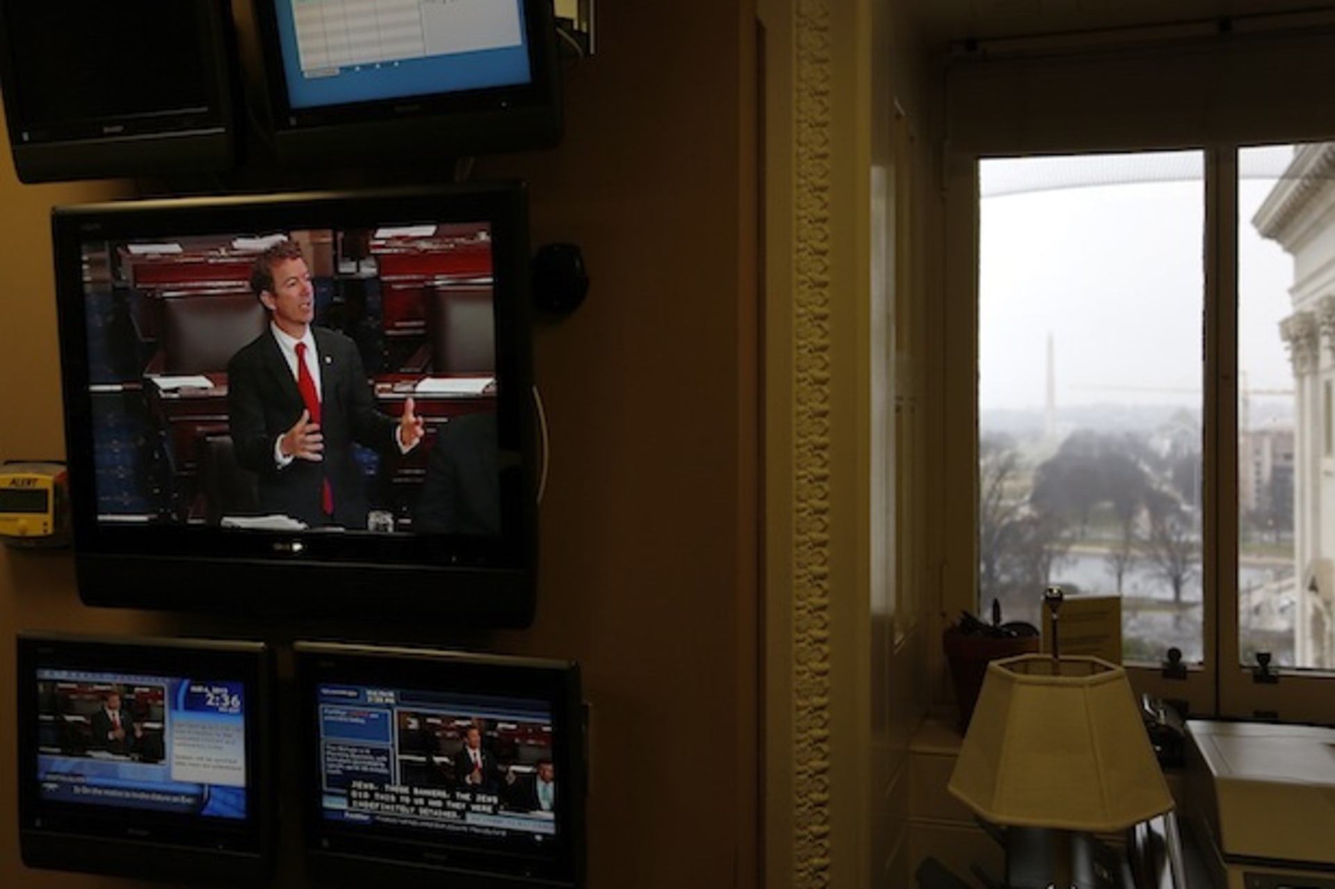 <p>U.S. senator Paul appears on a television screen in an office at the U.S. Capitol as he filibusters in opposition to the nomination of Brennan to lead the CIA on March 6, 2013 (Jonathan Ernst/Courtesy Reuters).</p>

