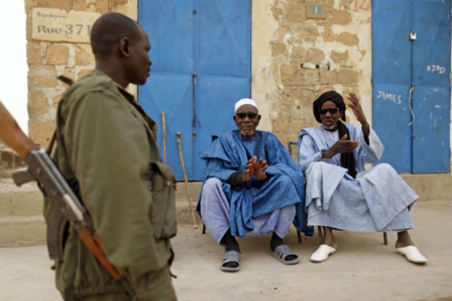 1.	 A Malian soldier talks with civilians in central Timbuktu January 31, 2013. Mali's president offered Tuareg rebels talks on Thursday in a bid for national reconciliation after a French-led offensive drove their Islamist former allies into m