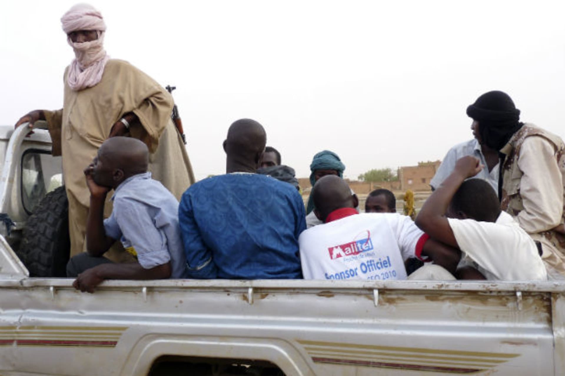 Militiaman from the Ansar Dine Islamic detain men in northeastern Mali 18/06/2012.