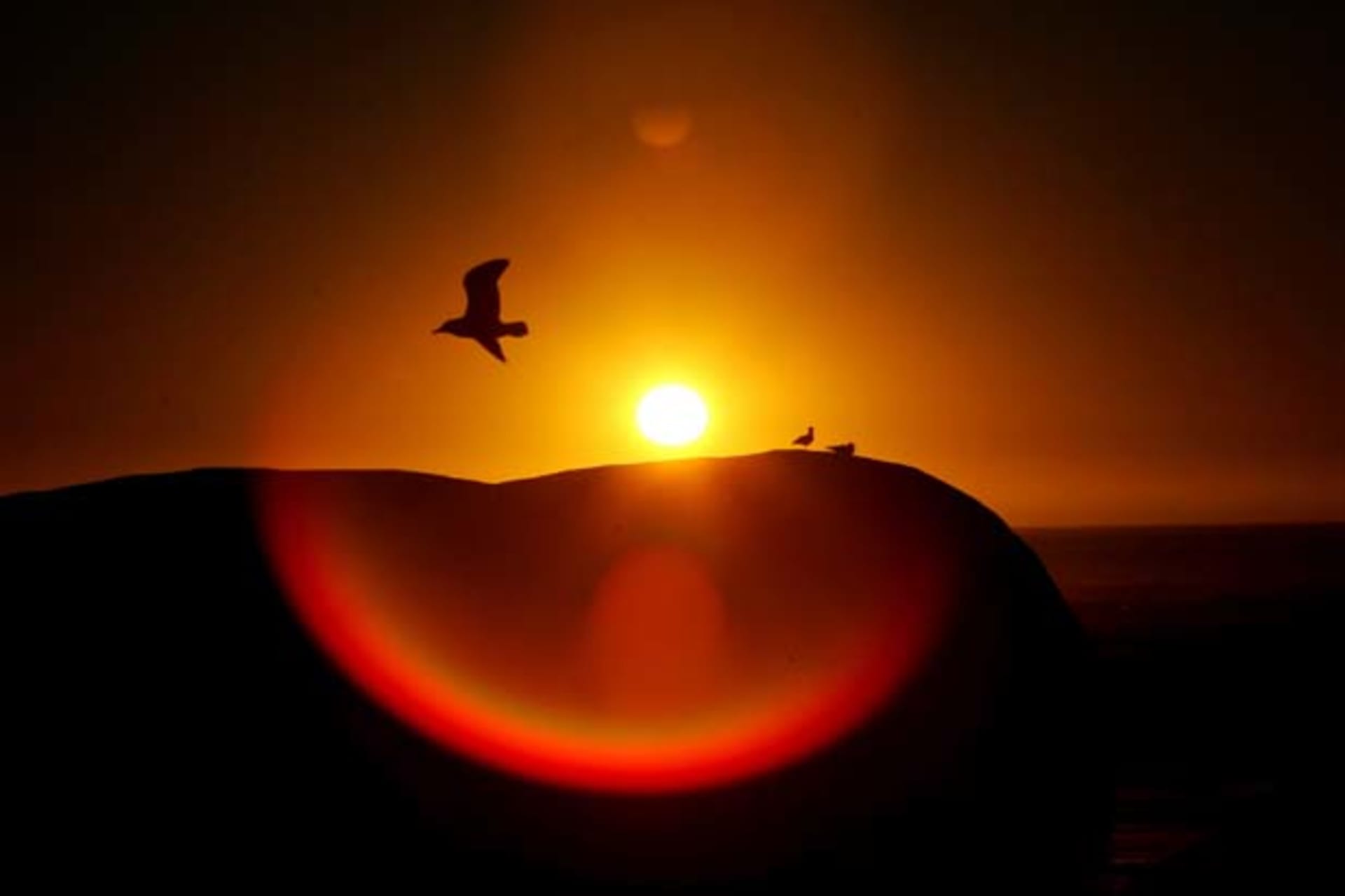 <p>The sun sets over Clifton Beach in Cape Town, South Africa. (Mike Hutchings/Courtesy Reuters)</p>

