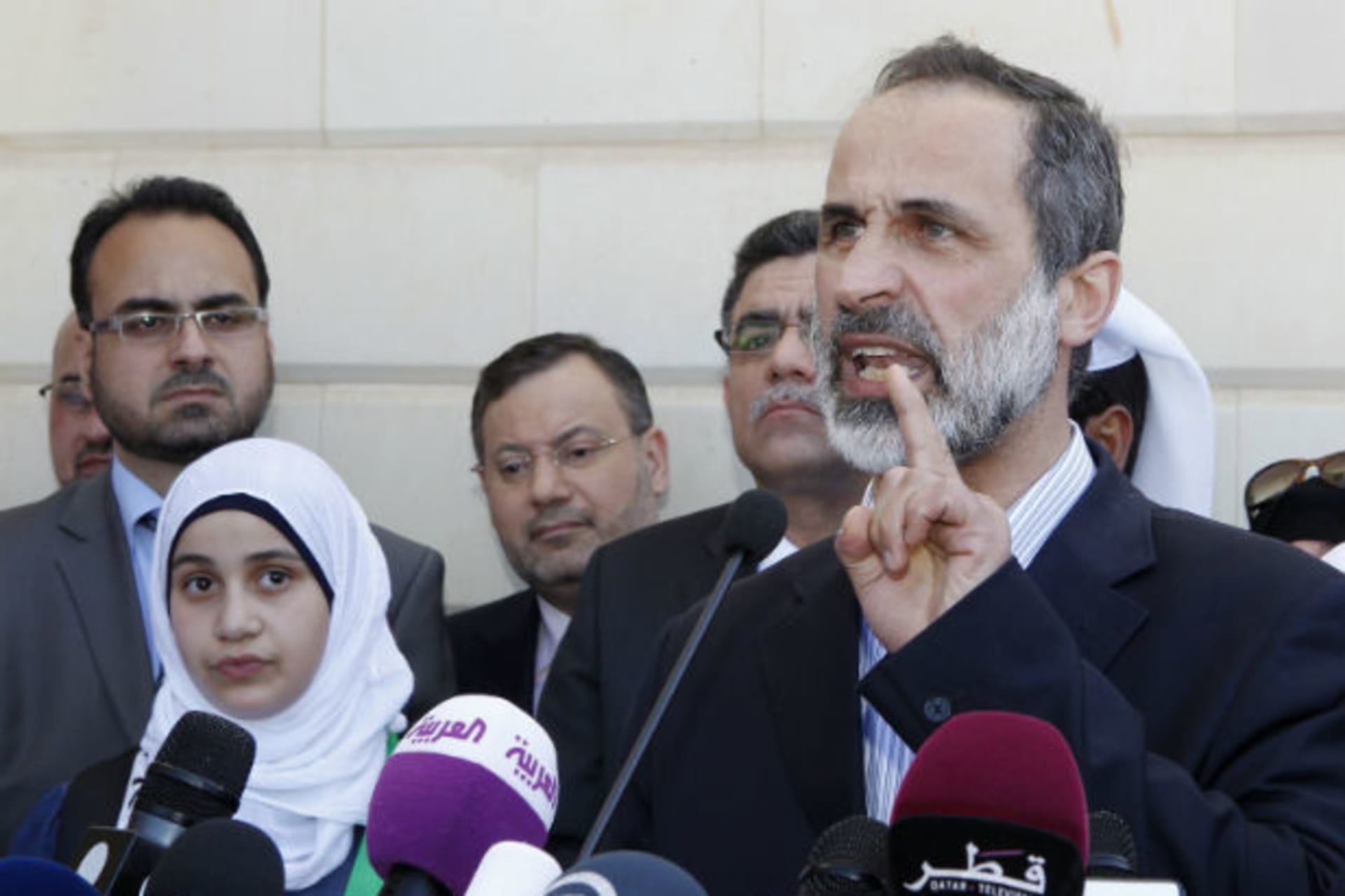Syrian National Coalition leader Moaz Alkhatib speaks to journalists during the opening of its embassy in Doha on March 27, 2013 (Dabbous/Courtesy Reuters).