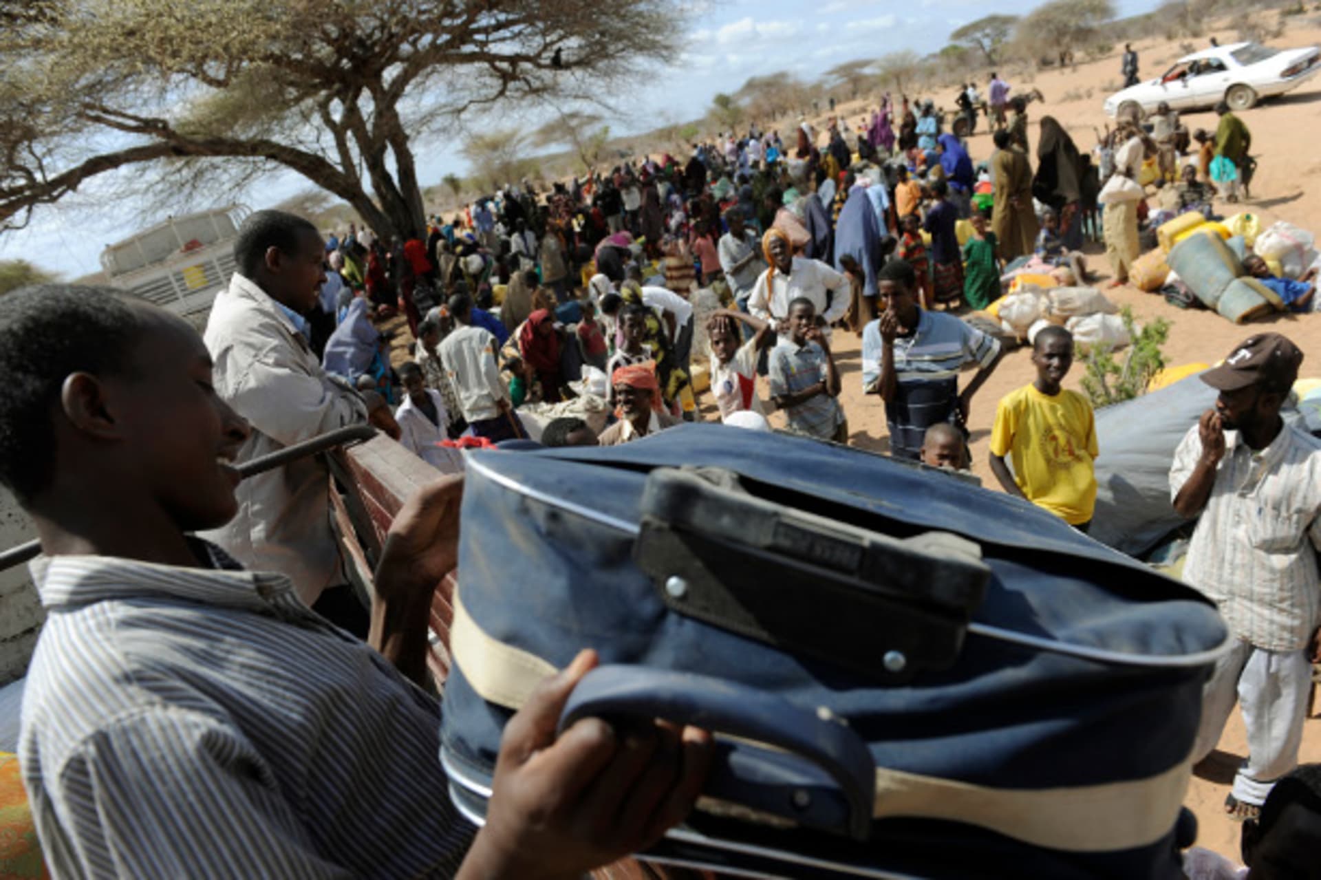 Refugees who have been living in the outskirts of the proper camps in Hagadera load their belongings onto trucks as they choose to relocate to the newly-opened Kambioos settlement, at Kenya's Dadaab Refugee Camp, situated northeast of the capit