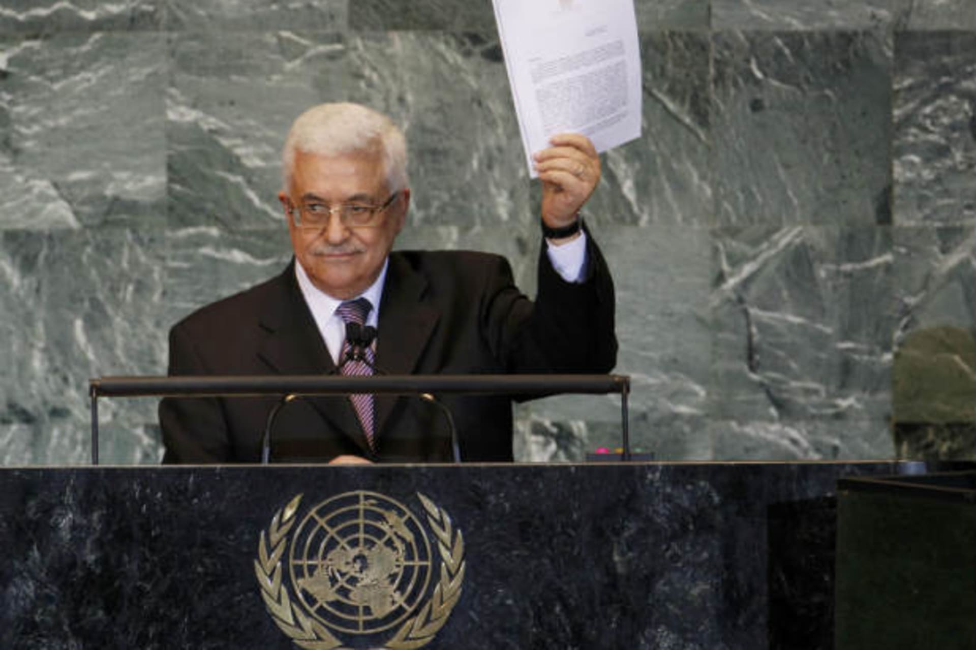 Palestinian president Mahmoud Abbas holds up a copy of the letter seeking statehood he had just delivered to United Nations secretary general Ban Ki-moon (Segar/Courtesy Reuters).