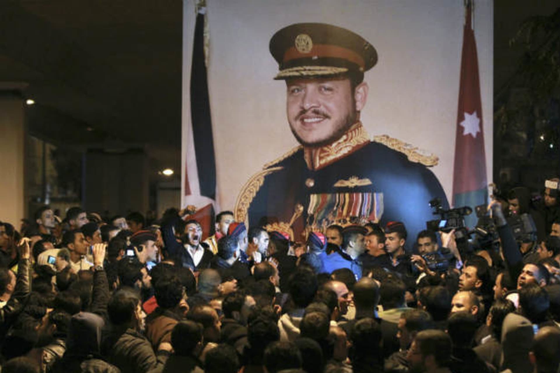 Jordanian policemen stand guard to separate protesters during a demonstration following an announcement that Jordan would raise fuel prices, in Amman on November 13, 2012 (Hamed/Courtesy Reuters).