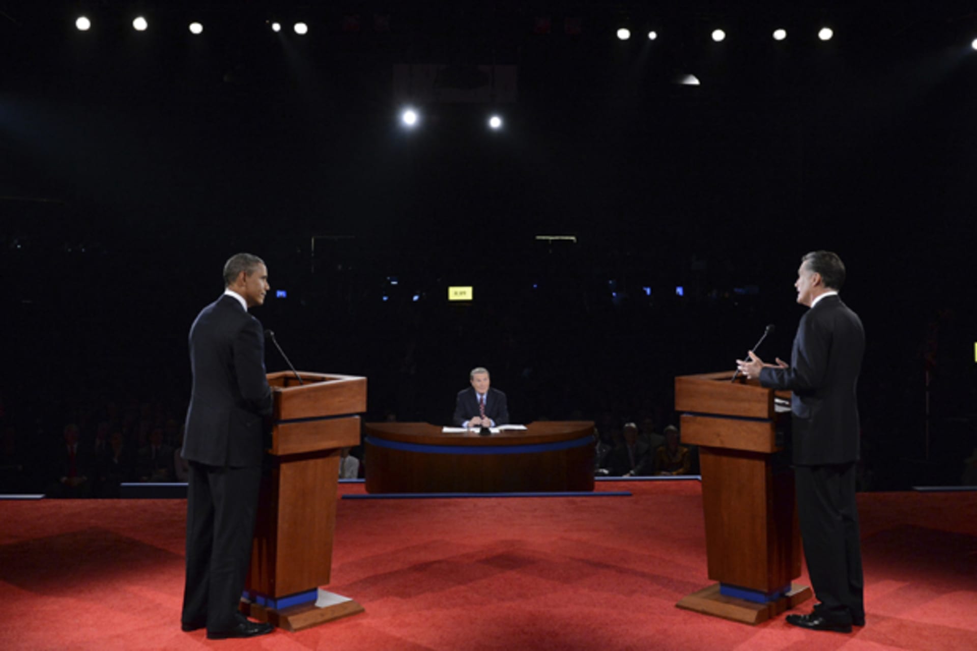 Republican presidential nominee Mitt Romney answers a question as President Barack Obama listens during the first 2012 U.S. presidential debate in Denver