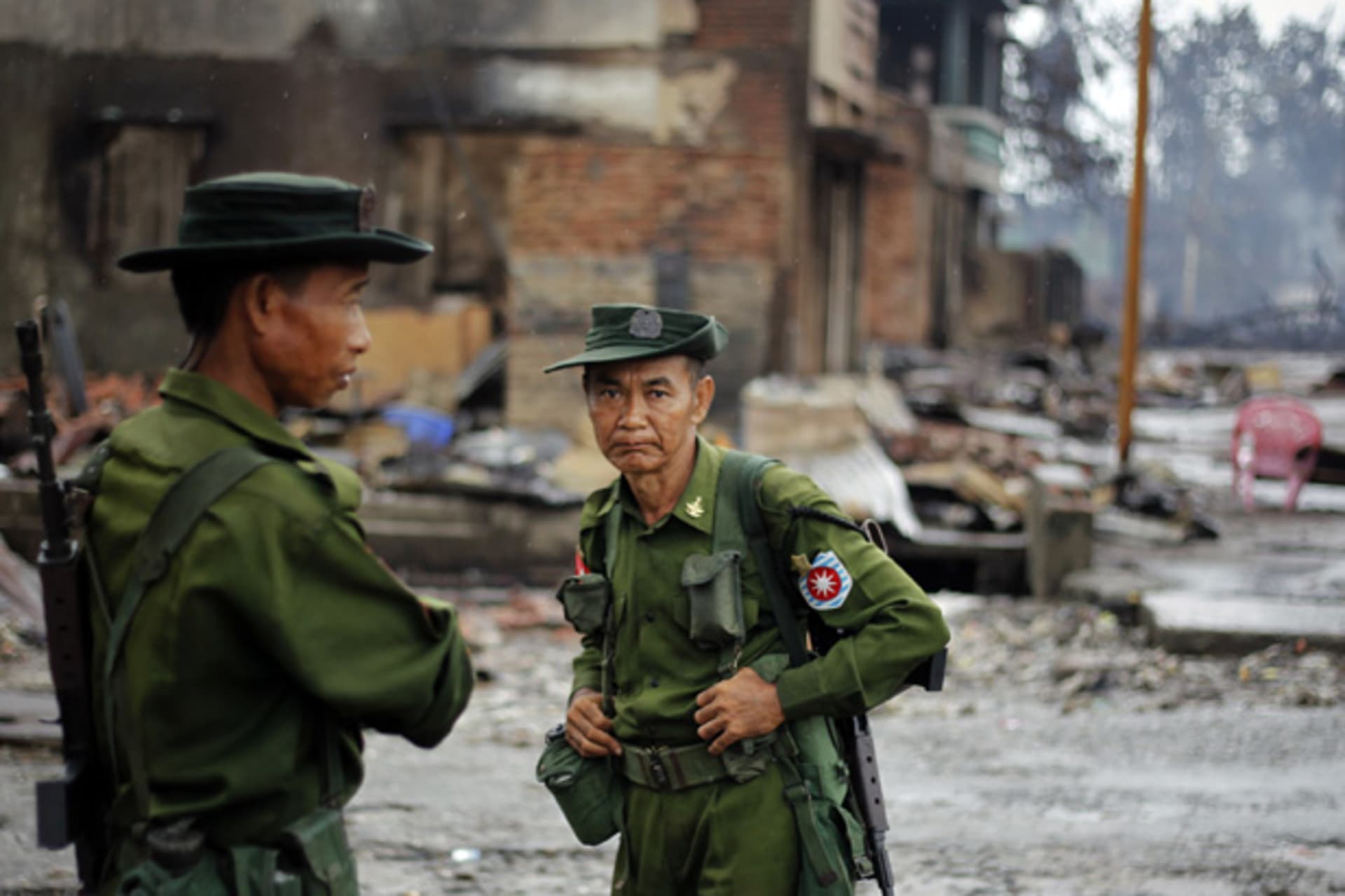<p>Soldiers patrol through a neighbourhood that was burnt during this summer’s violence in Sittwe, Rakhine State.</p>
