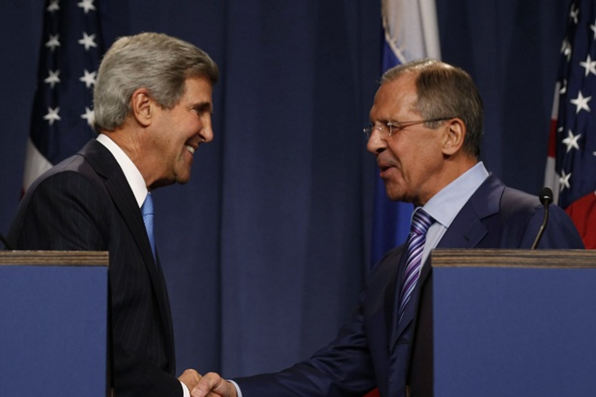 U.S. Secretary of State Kerry shakes hands with Russian Foreign Minister Lavrov after delivering opening remarks to the media before their meeting to discuss the ongoing crisis in Syria, in Geneva