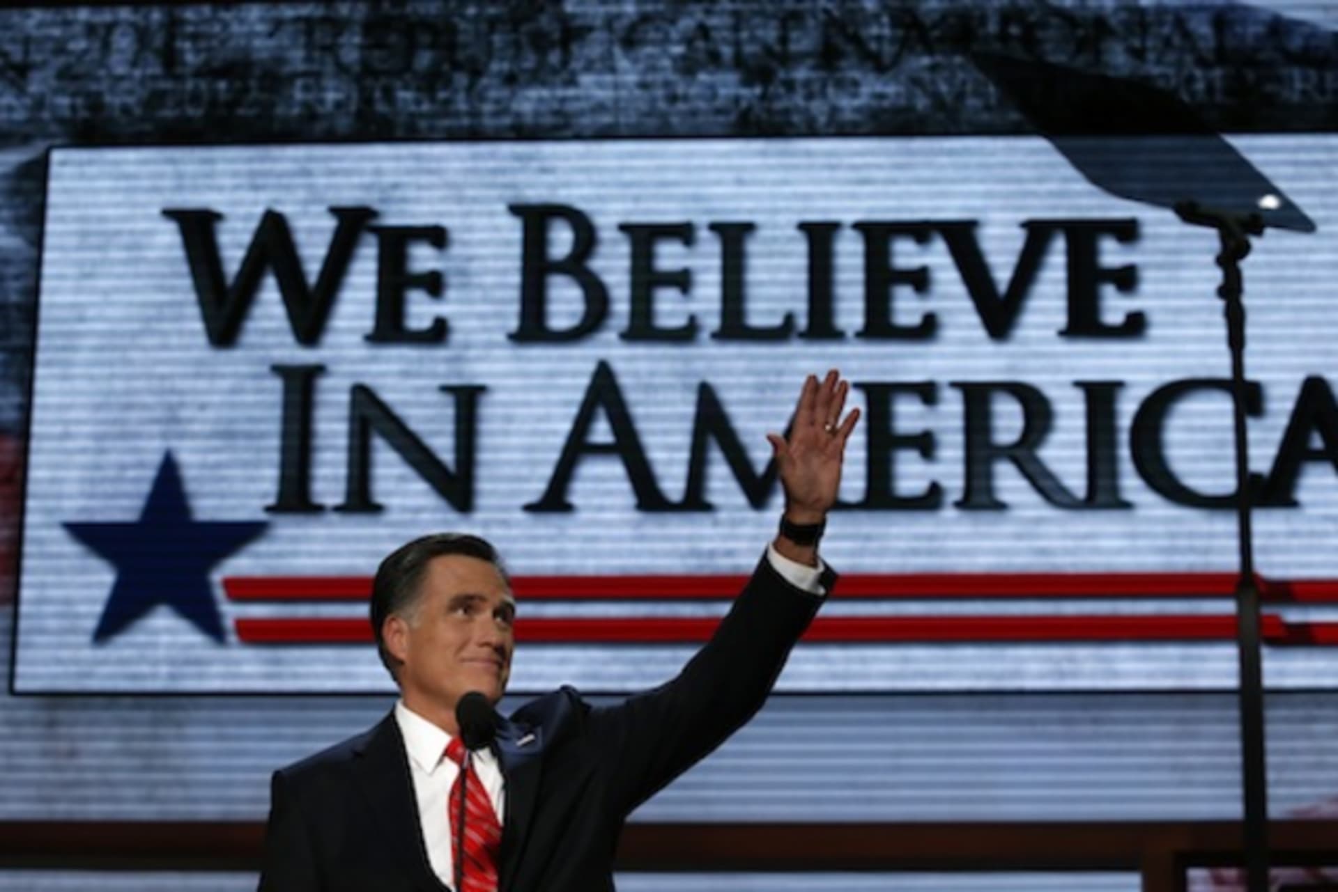 <p>Mitt Romney waves as he arrives onstage to accept the nomination during the Republican National Convention in Tampa. (Adrees Latif/ courtesy Reuters)</p>
