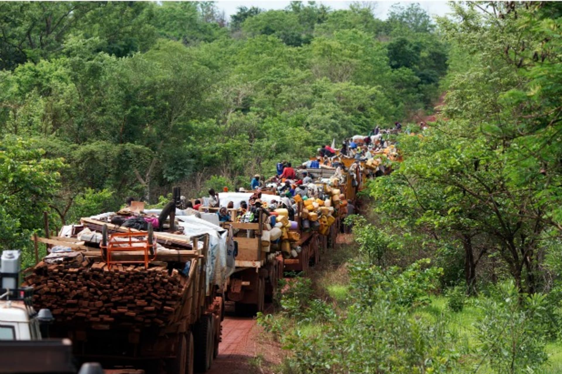 <p>Internally displaced persons (IDPs) take a break on an armed peacekeeping convoy as they are escorted from the capital Bangui to the northern towns of Kabo and Sido on the border with Chad, April 28, 2014 (Courtesy Reuters/Modola).</p>
