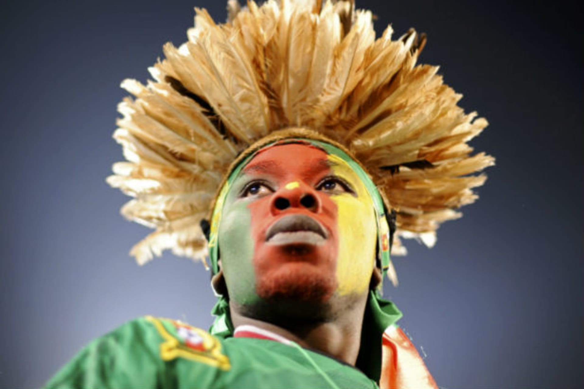 A fan waits for the start of a 2010 World Cup Group E soccer match between Cameroon and Denmark at Loftus Versfeld stadium in Pretoria, June 19, 2010. (Dylan Martinez/Courtesy Reuters)