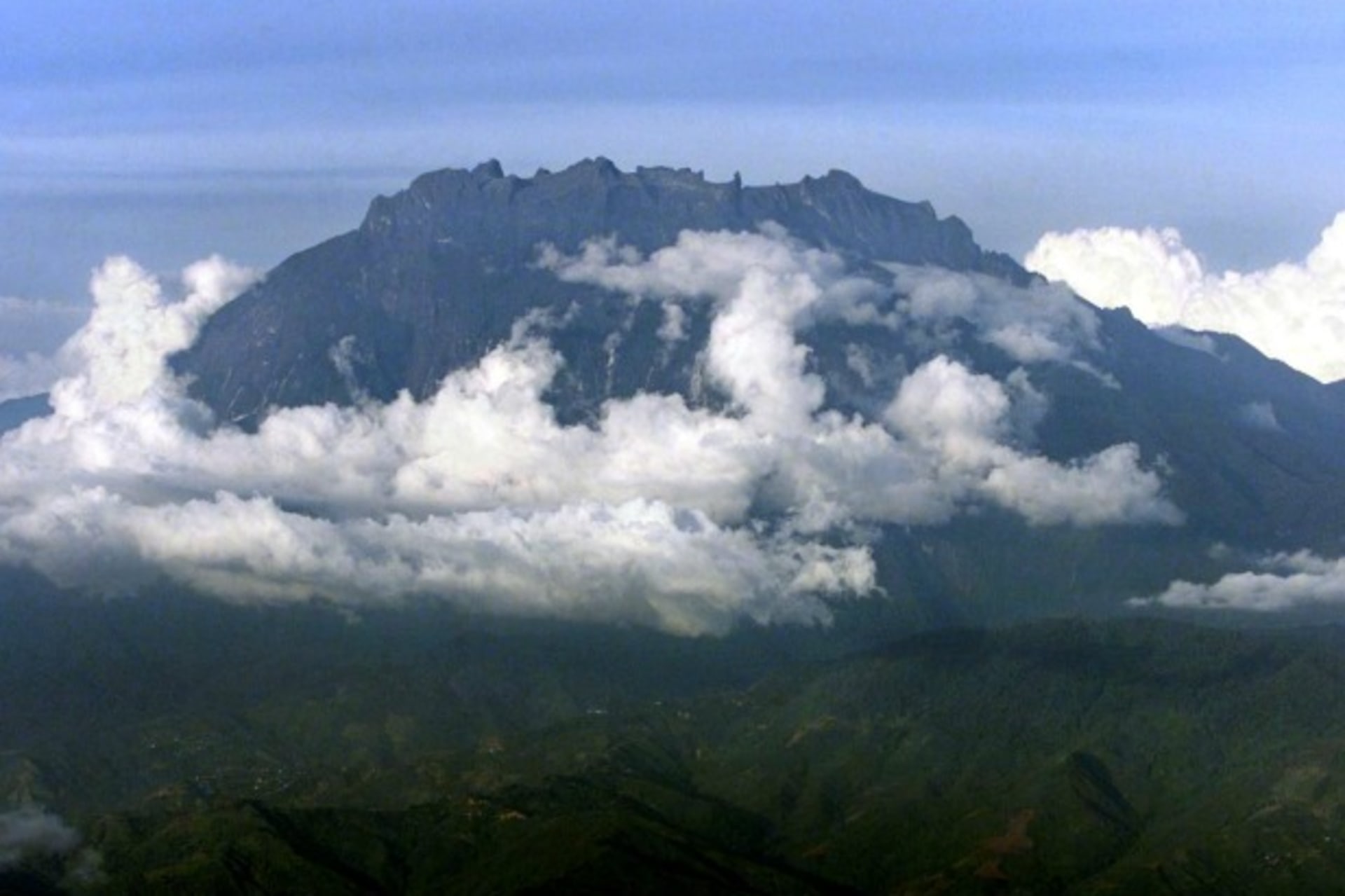 <p>Mount Kinabalu appears through the clouds over Kota Kinabalu, capital of the east Malaysian state of Sabah on Borneo island, i…u is Southeast Asia’s highest mountain, standing at 4,095 metres (13,432 feet). Picture taken March 8. REUTERS/Bazuki Muhammad</p>

