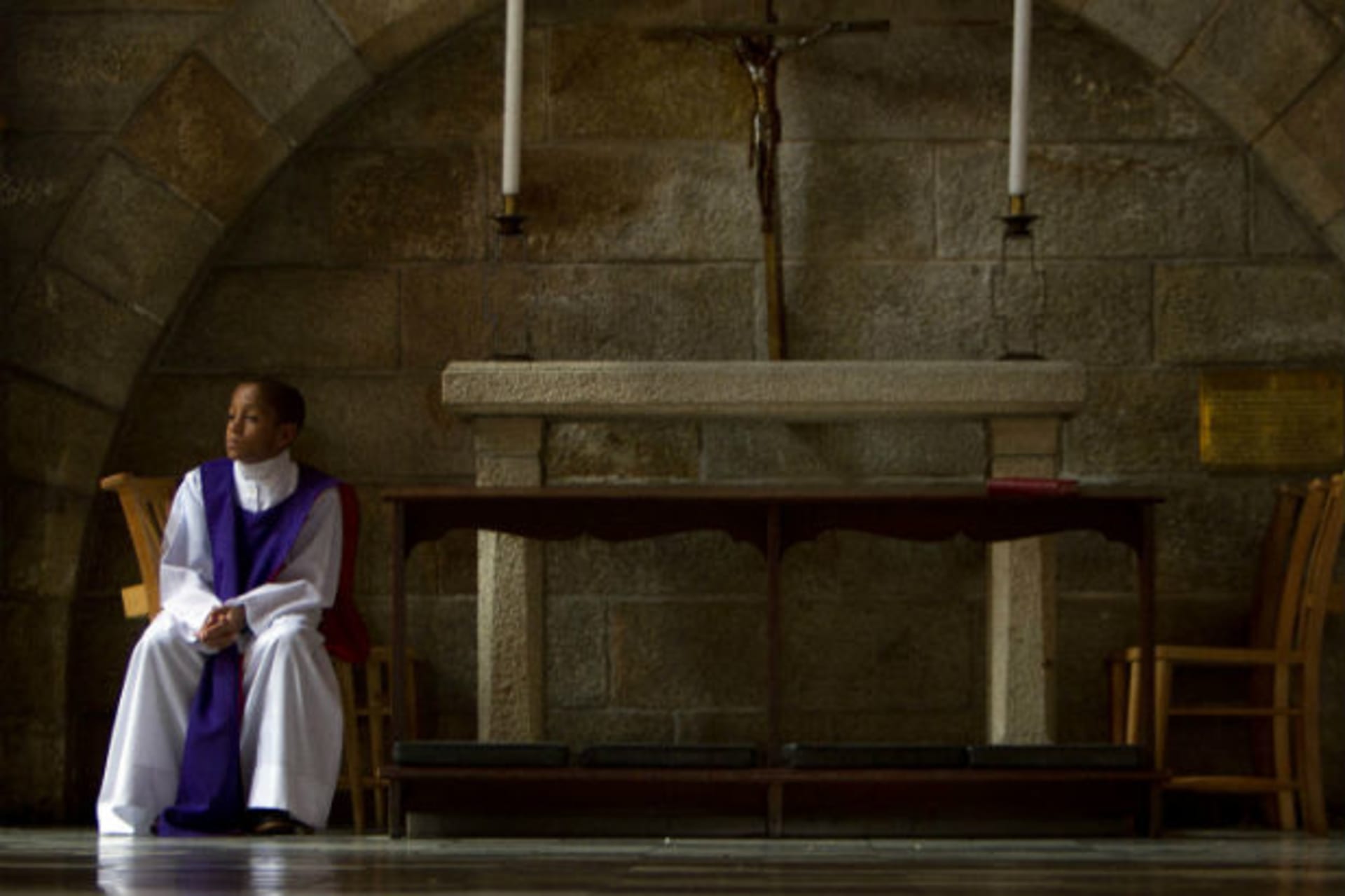 Anglican altar server Akin Ajayi, eleven, waits in the church as people attend a special Sunday morning service dedicated to Nelson Mandela at St. George's Cathedral in Cape Town, December 8, 2013. (Mark Wessels/Courtesy Reuters)