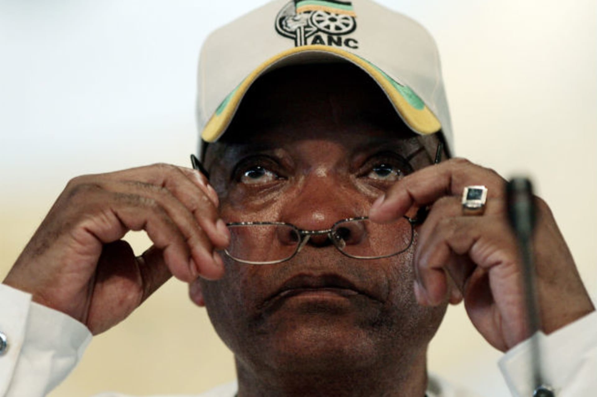 ANC's Deputy President Jacob Zuma puts on his reading glasses during the opening of a leadership conference in Polokwane December 16,2007.