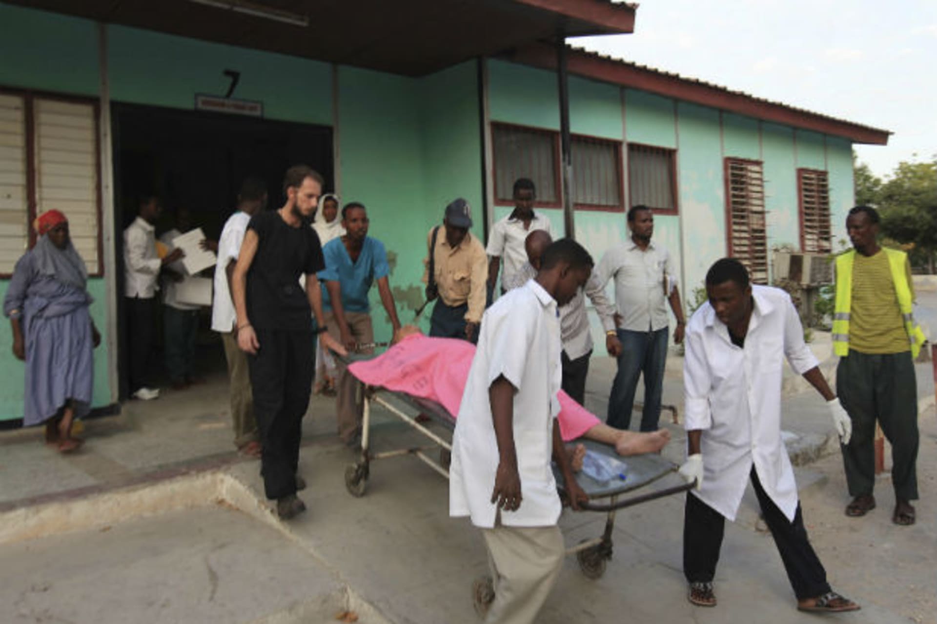 AMadina hospital staff help to wheel an injured Medecins Sans Frontieres (MSF) personnel on a stretcher south of capital Mogadishu December 29, 2011.