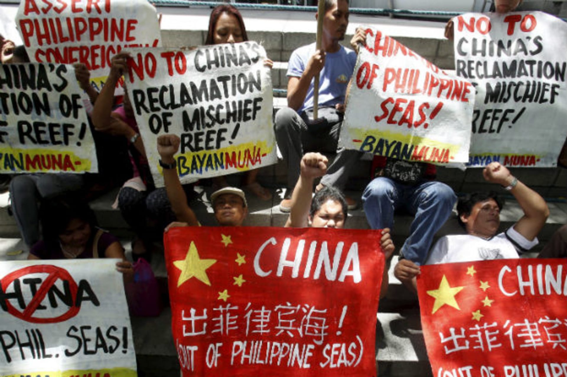 <p>Filipino activists protest Chinese reclamation in the South China Sea outside the Chinese embassy in Manila on April 17, 2015.</p>
