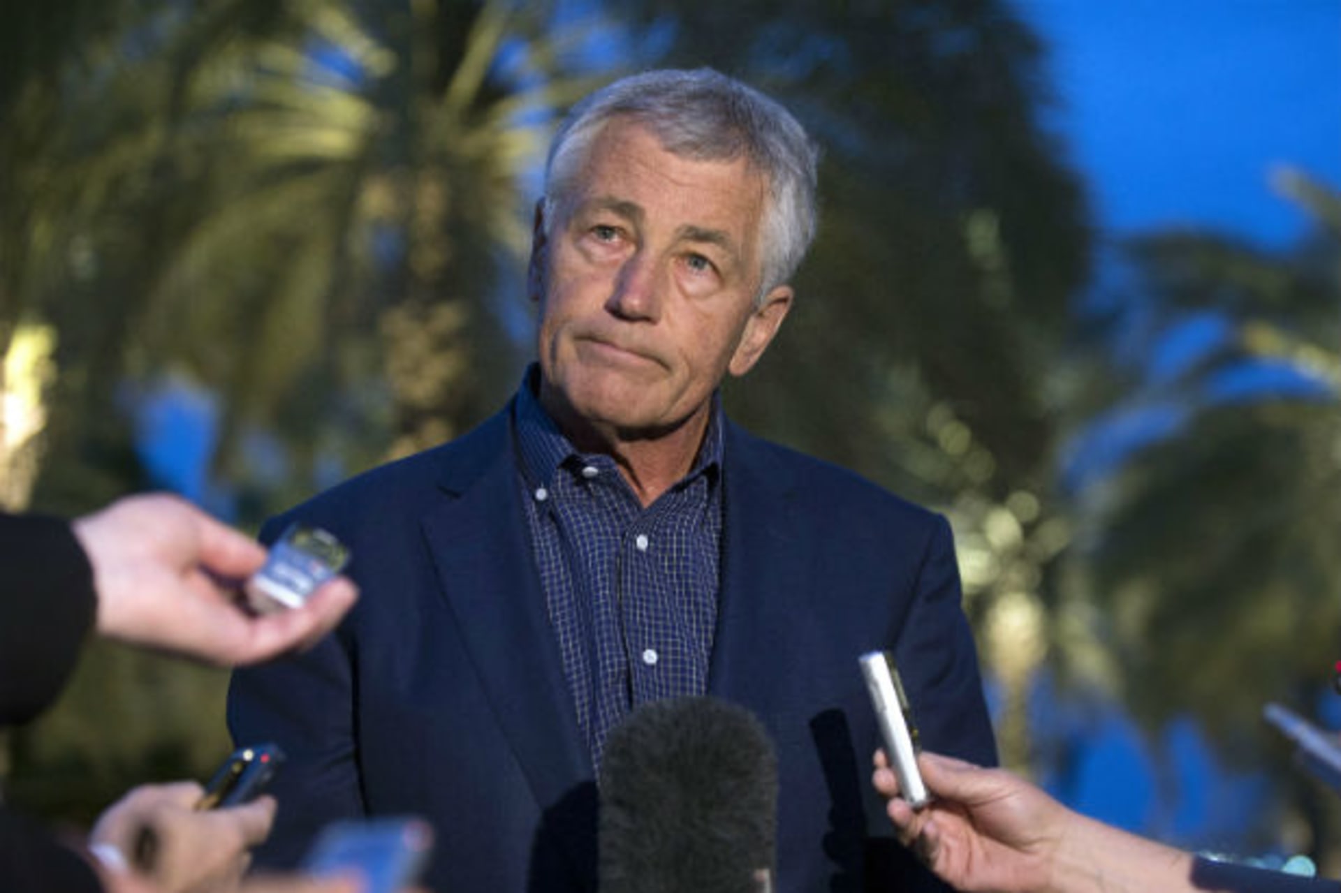 <p>U.S. Secretary of Defense Chuck Hagel speaks with reporters after reading a statement on chemical weapon use in Syria during a news conference in Abu Dhabi. (Jim Watson/Courtesy Reuters).</p>
