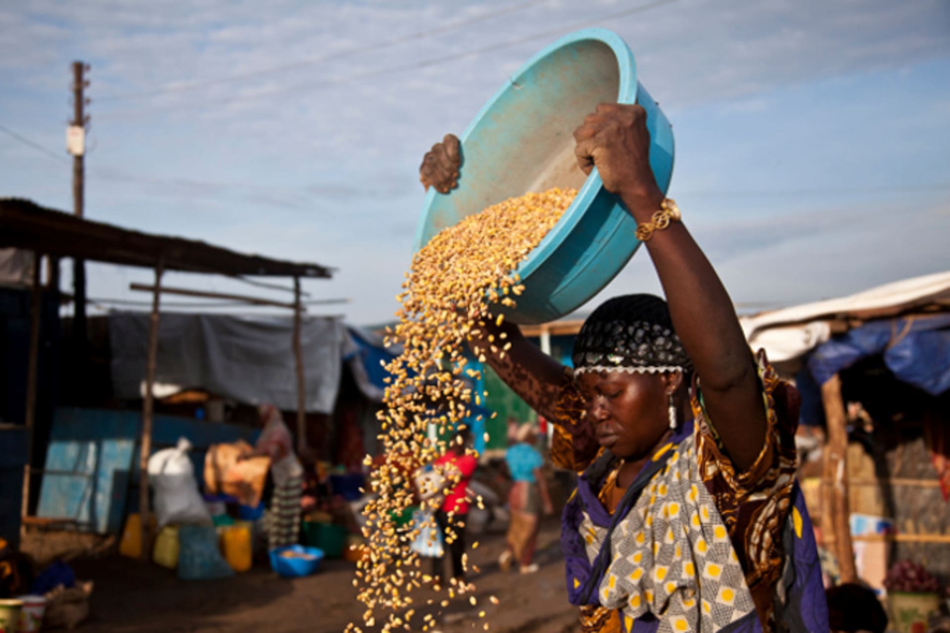 A woman sets up her shop at the Konyo Konyo market in Juba, South Sudan, May 12, 2012.