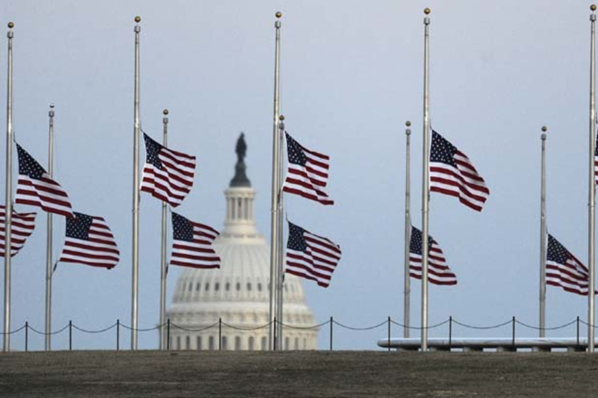 <p>American flags fly at half mast. (Jonathan Ernst/Courtesy Reuters)</p>
