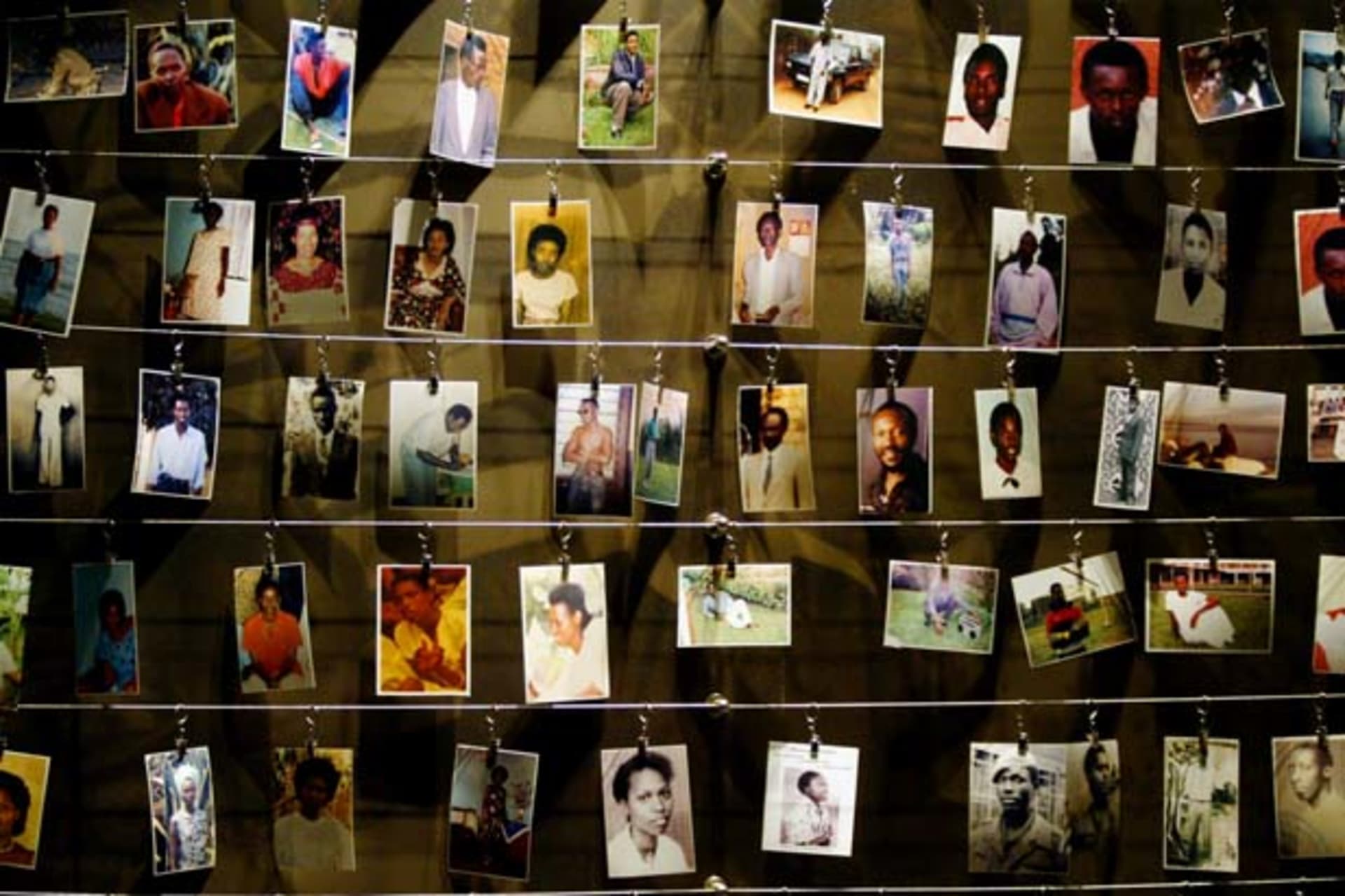 <p>Pictures of victims of the 1994 Rwandan genocide on display at the Gisozi memorial in Kigali. (Radu Sigheti Pictures of the Year 2004/Courtesy Reuters)</p>
