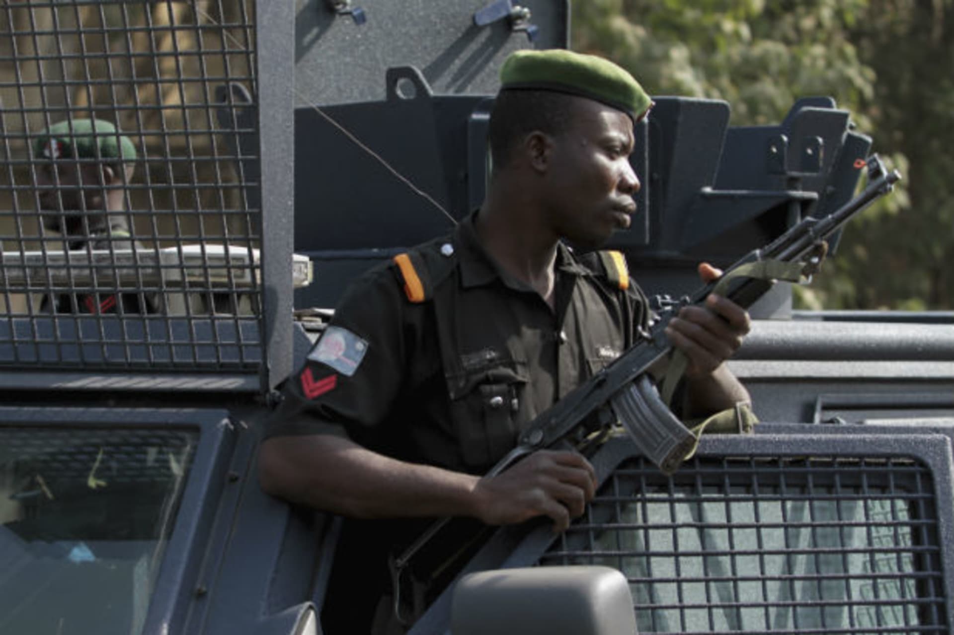 A police officer keeps watch during a protest against the elimination of a popular fuel subsidy that has doubled the price of petrol, in Nigeria's capital Abuja January 9, 2012.