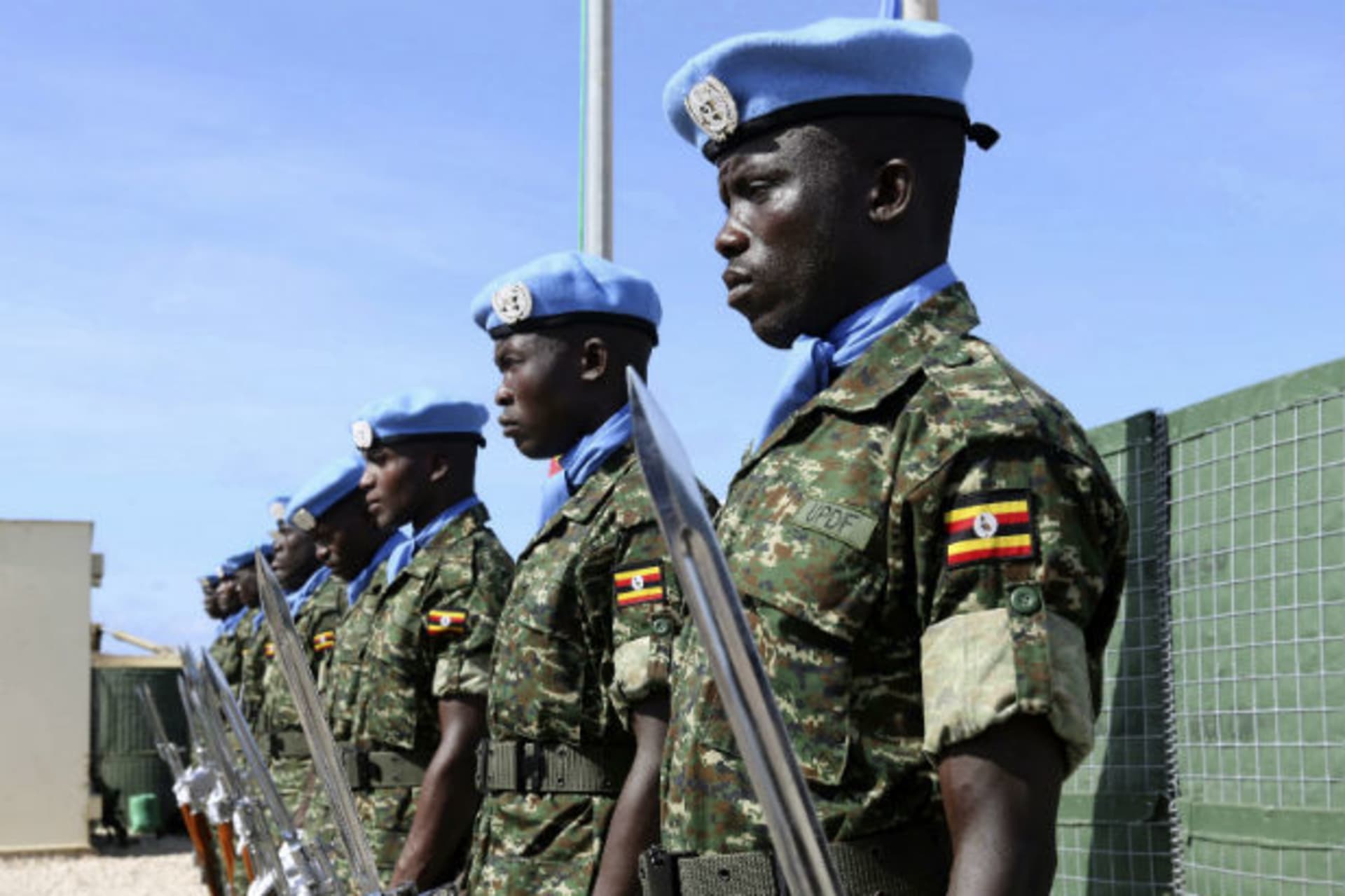 Ugandan peacekeeping troops stand during a ceremony at Mogadishu airport in Somalia May 18, 2014.