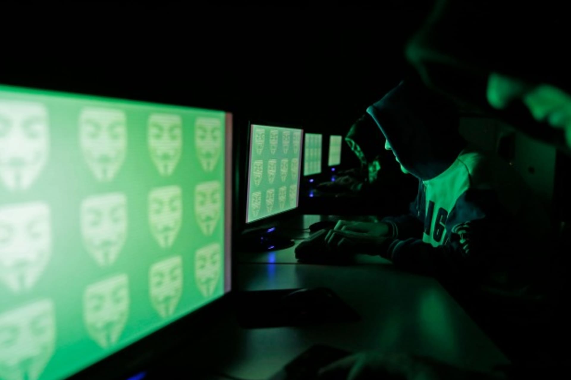 <p>People pose in front of a display showing the word ‘cyber’ in binary code, in this picture illustration taken in Zenica on December 27, 2014. (Dado Ruvic/Courtesy Reuters)</p>
