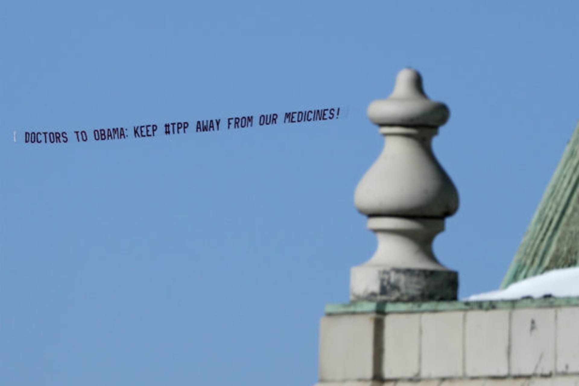 <p>An aerial banner reading “Doctors to Obama: Keep #TPP Away from Our Medicines!” flies above New York in January 2015. The bann…h has argued that the Trans-Pacific Partnership could restrict access to affordable generic medicines in developing countries.</p>
