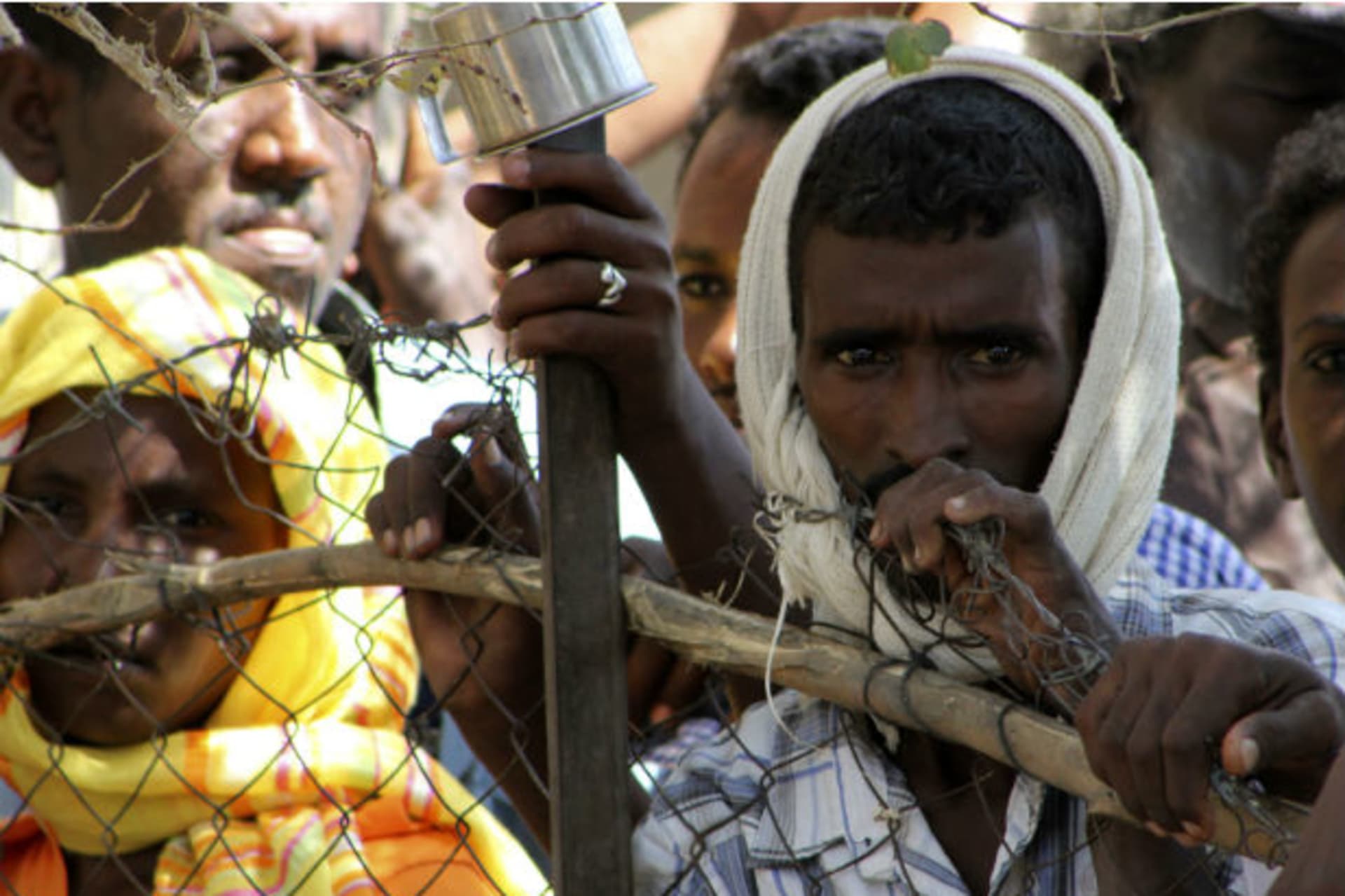 Refugees are seen during a visit by UN High Commissioner for Refugees Antonio Guterres to the Shagarab Eritrean Refugees camp at Kassala in East Sudan January 12, 2012.