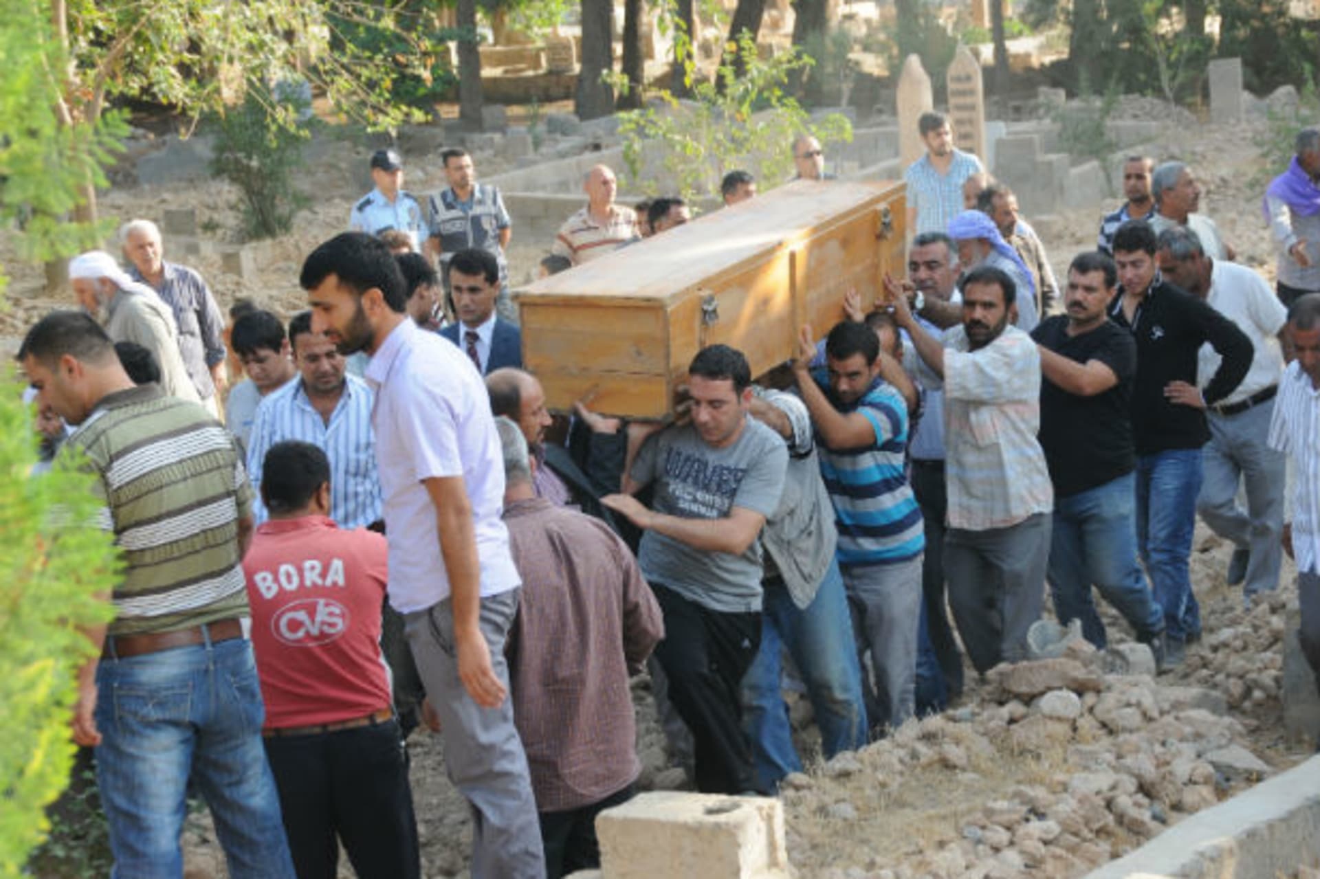 Relatives carry the coffin of a victim during a funeral procession at a cemetery in the border town of Akcakale on October 4, 2012 (Stringer/Courtesy Reuters).