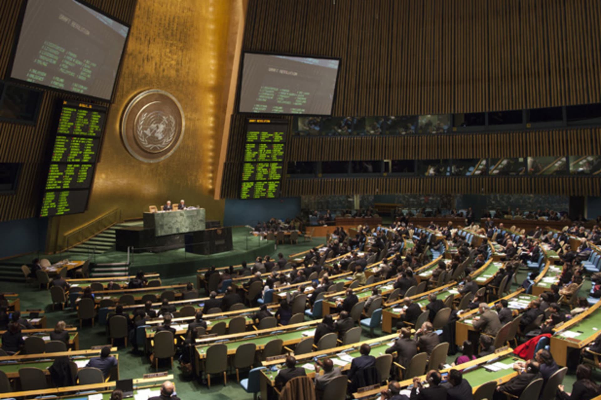 Members of the United Nations General Assembly vote to endorse the Arab League's plan for Syria's President Bashar al-Assad to step aside, at the United Nations Headquarters in New York