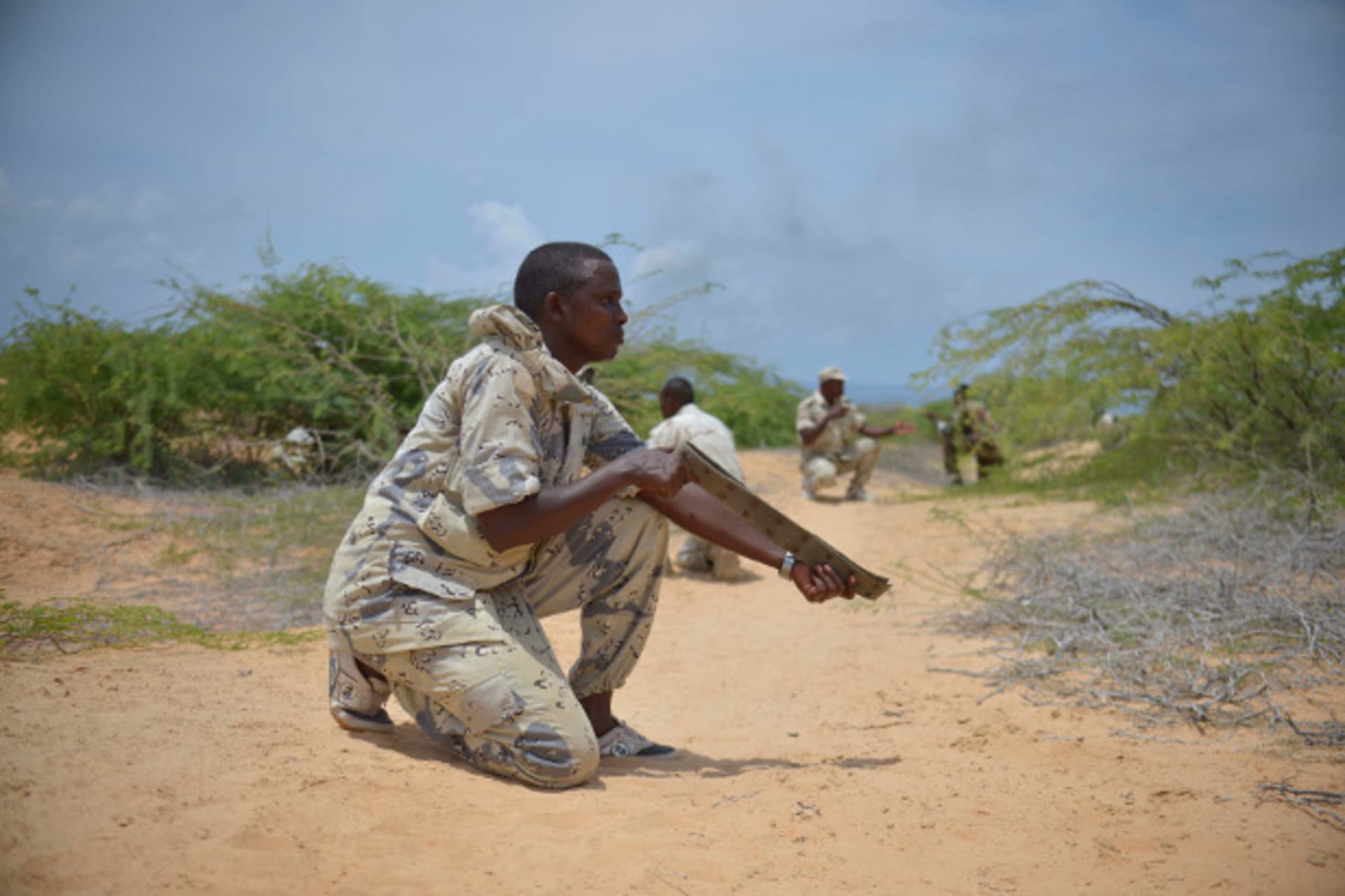 A soldier from the Somali National Army (SNA) uses a belt acting as a weapon during a training exercise in Mogadishu March 28, 2013