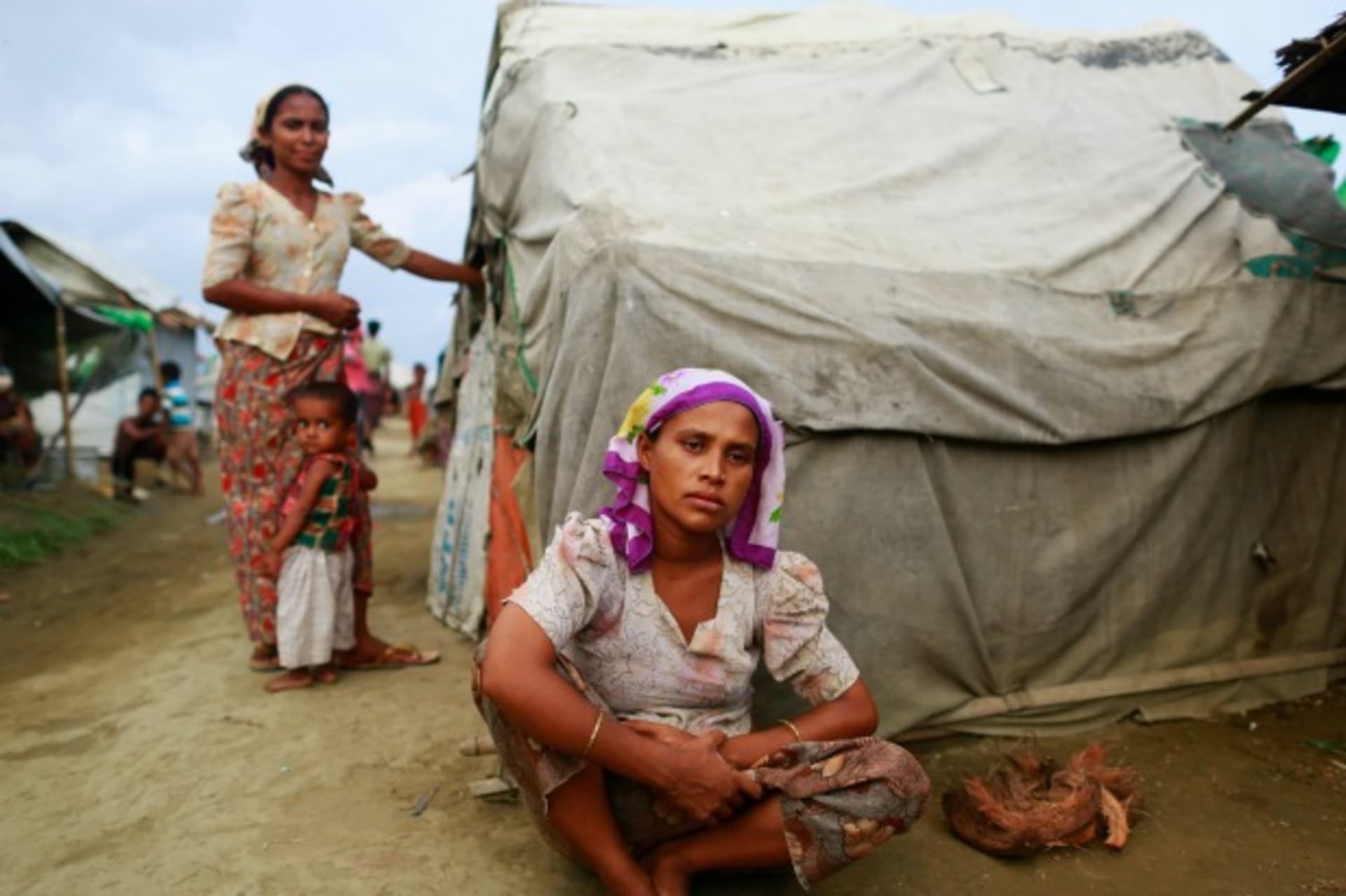 <p>Sinnuyar Baekon, 25, sits in front of her hut at a refugee camp outside Sittwe, the capital city of the Rakhine state June 9, …r homes. Picture taken June 9, 2014. REUTERS/Soe Zeya Tun (MYANMAR – Tags: SOCIETY IMMIGRATION POLITICS RELIGION CIVIL UNREST)</p>
