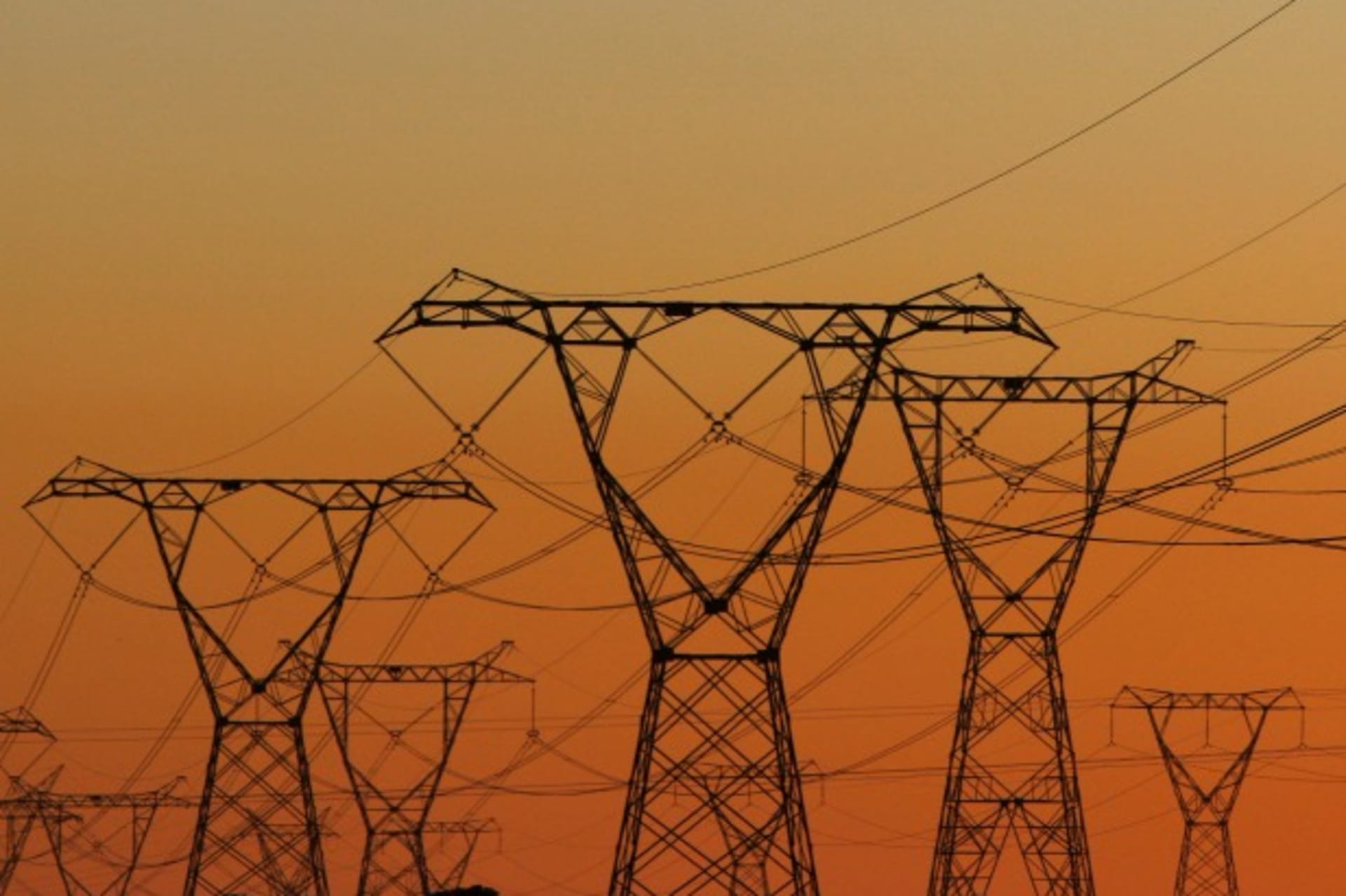 <p>Electricity pylons carry power from Cape Town’s Koeberg nuclear power plant July 17, 2009 (Courtesy Reuters/Mike Hutchings).</p>
