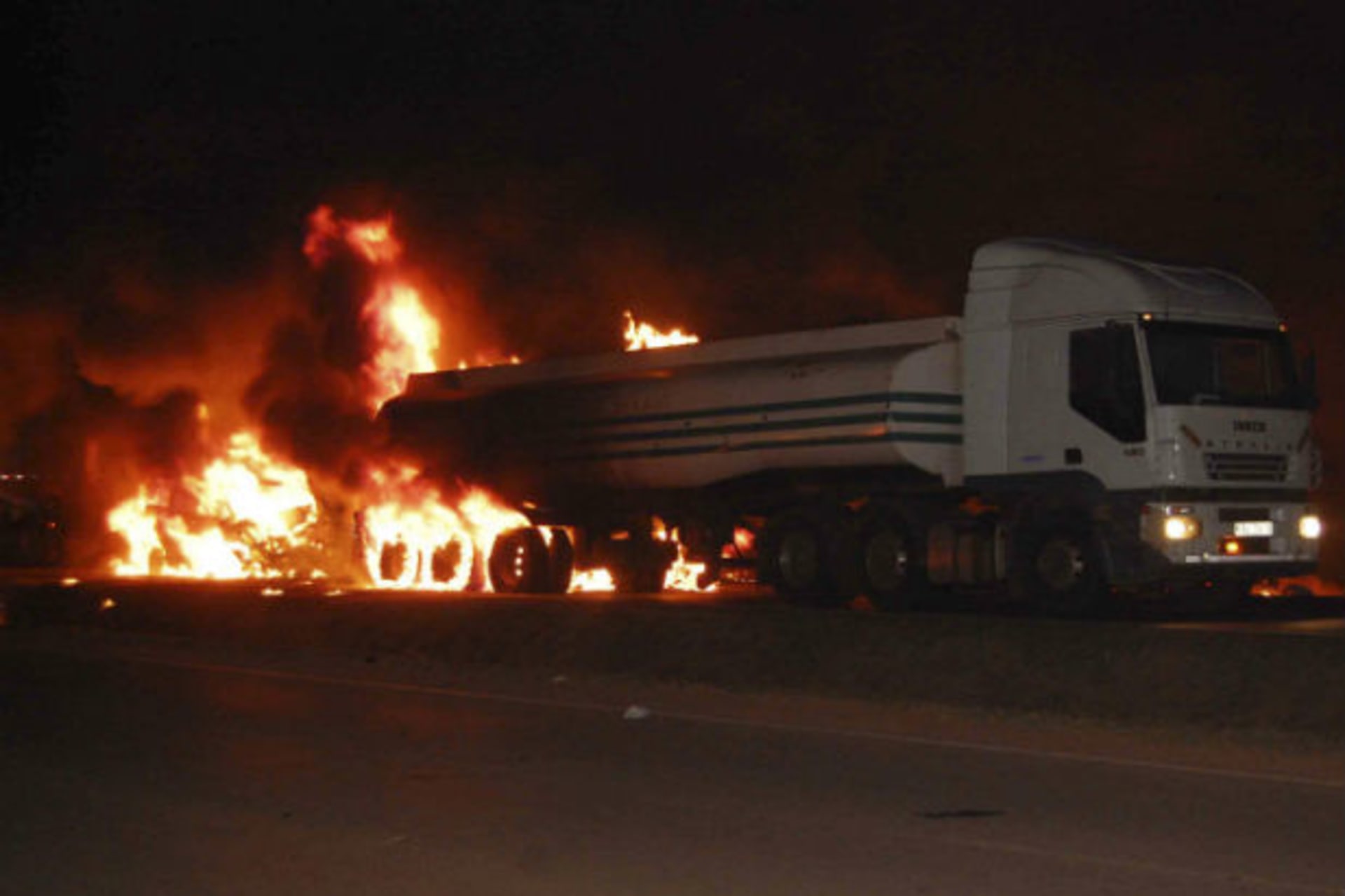 A fuel tanker burns at the scene of a fatal road accident on the outskirts of the capital Kampala June 30, 2013.