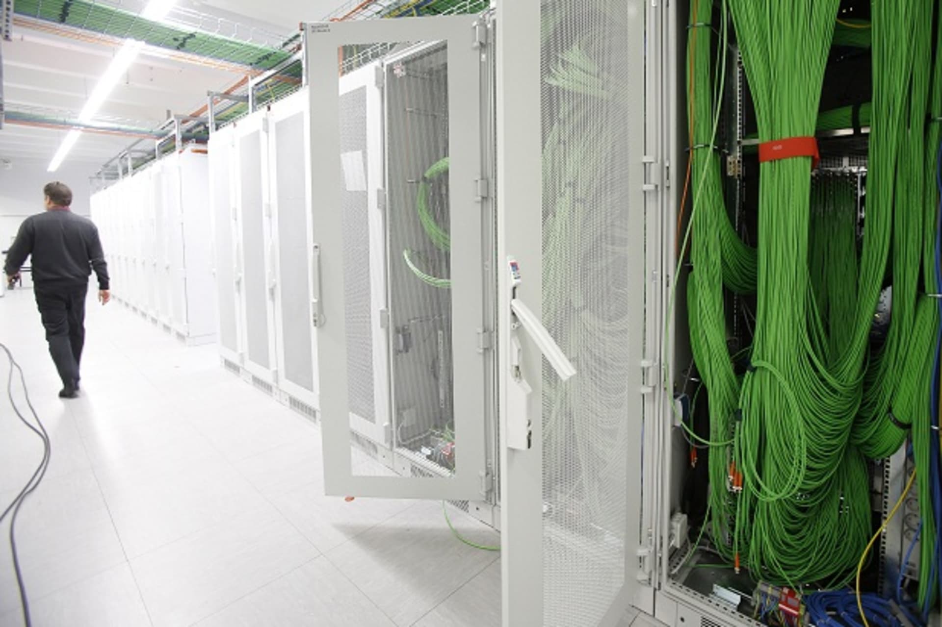 An employee of  Kabel Deutschland,makes his way in the server room with video cables at the Kabel Deutschland playout center in Frankfurt