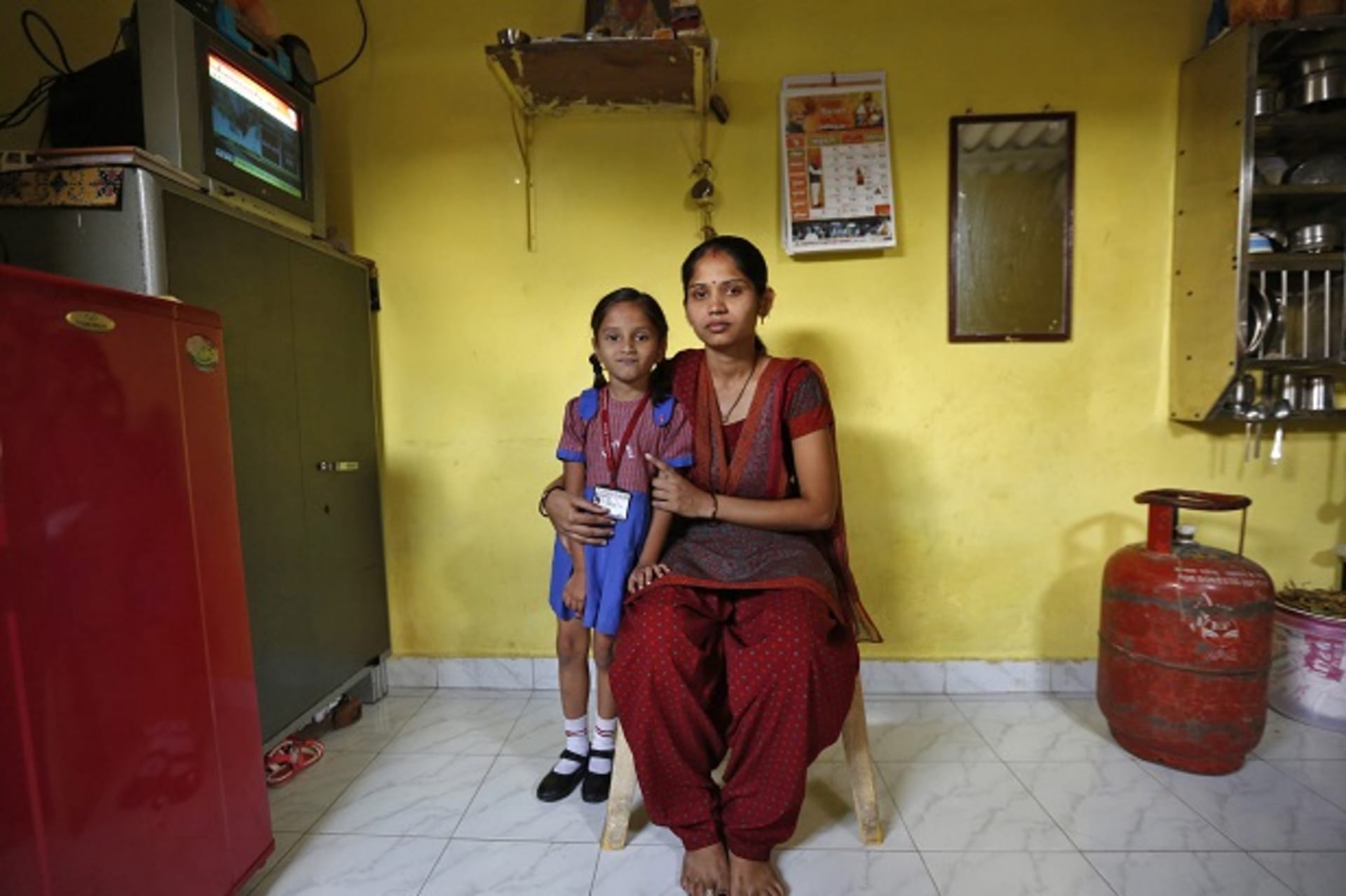 Sulochna Mohan Sawant poses with her daughter Shamika Sawant inside their home in Mumbai