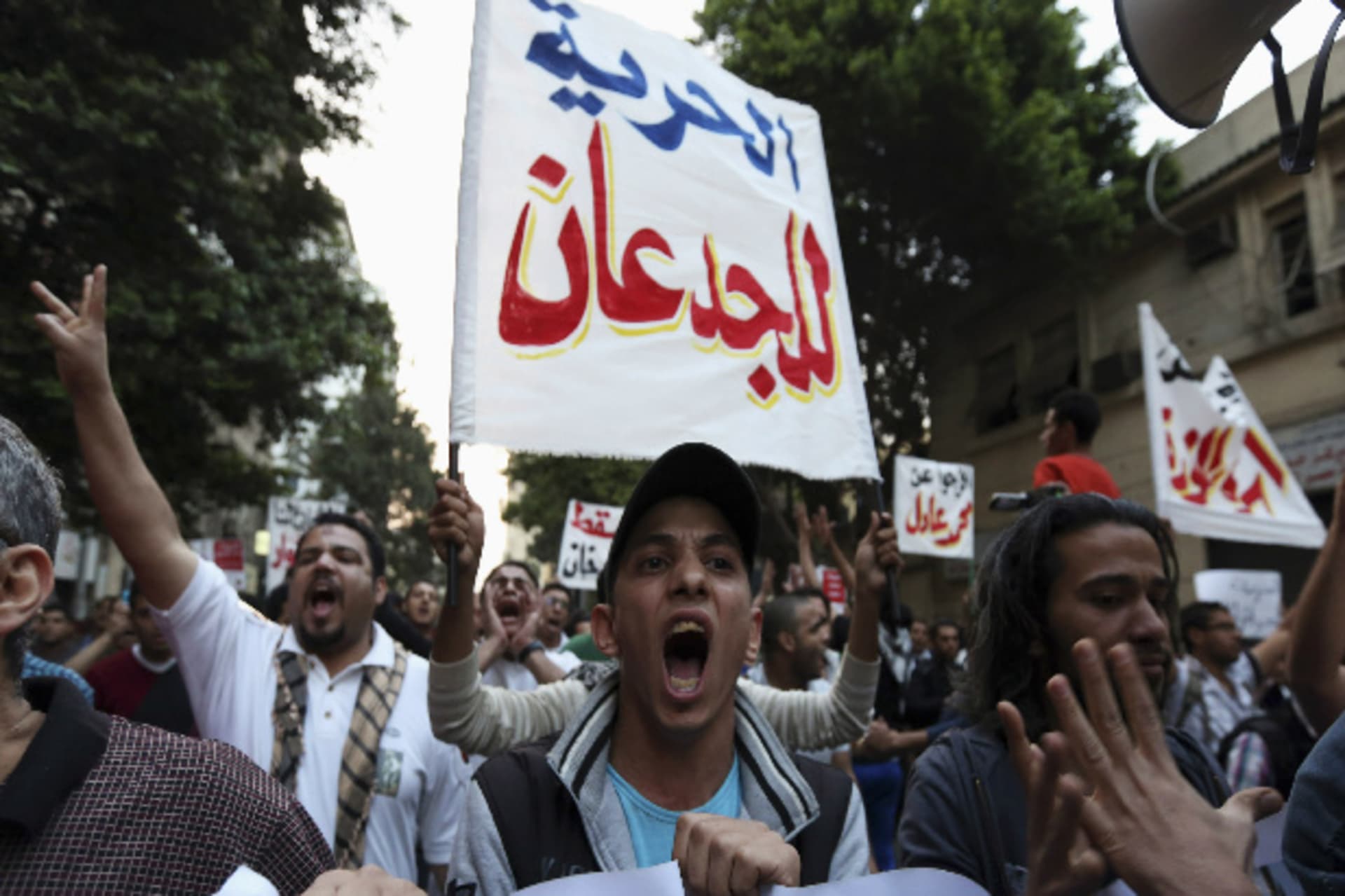People wave banners in a demonstration in Cairo April 10, 2014 (El Ghany/Courtesy Reuters).