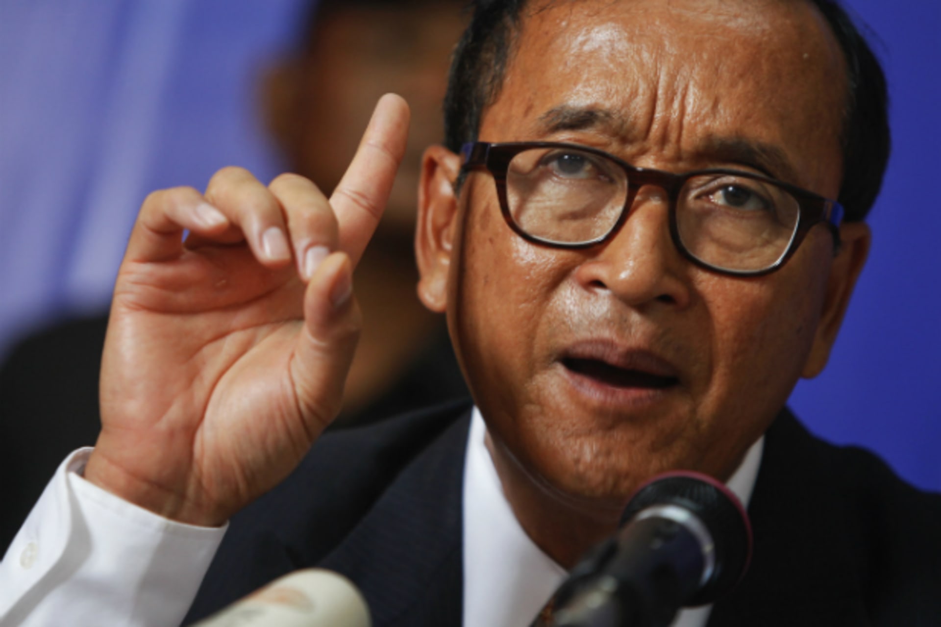<p>Sam Rainsy, president of the Cambodia National Rescue Party (CNRP) makes a point as he addresses reporters at his party’s head…d won, and called for an inquiry into what it called massive manipulation of electoral rolls. (Pring Samrang/Courtesy Reuters)</p>
