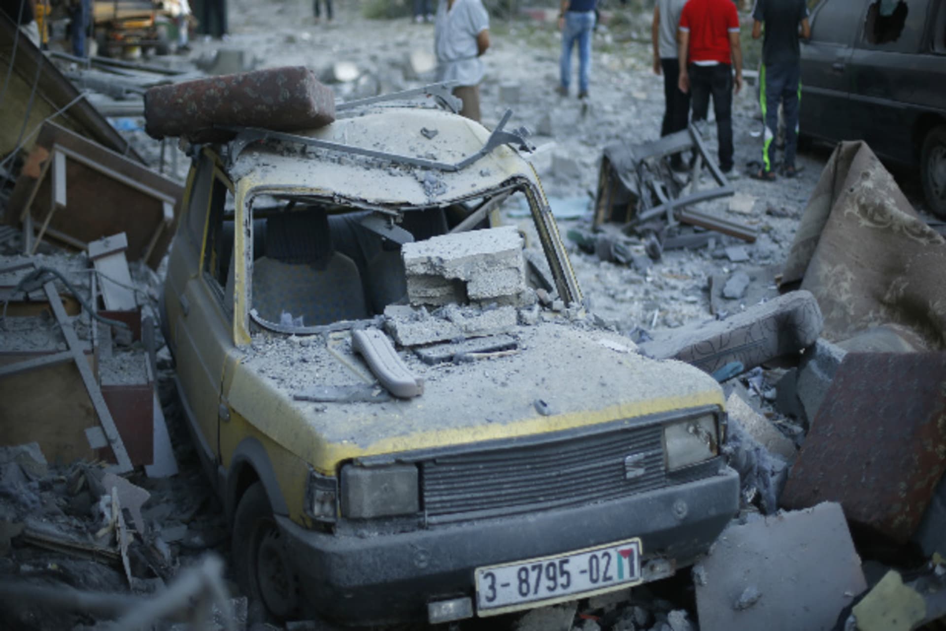 A car, which police said was damaged in an Israeli air strike that targeted the house of top Hamas political leader Mahmoud Zahar, is seen in Gaza City July 16, 2014 (Salem/Courtesy Reuters).