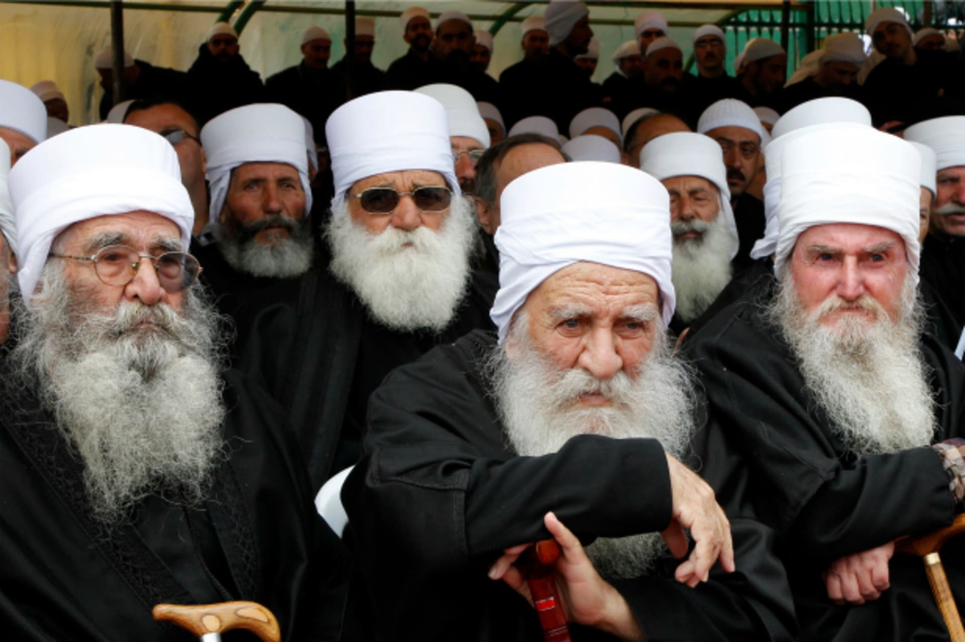 <p>Druze clerics attend the funeral ceremony of top Druze cleric Sheikh Ahmed Salman al-Hajri in al-Suwayda city (Khaled al-Hariri/Reuters).</p>
