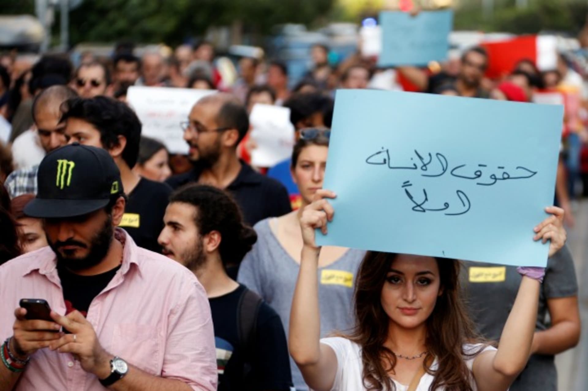 <p>People attend a demonstration against sectarianism, also calling for abolishing curfews put on Syrian refugees in Beirut, Lebanon (Mohamed Azakir/Reuters).</p>