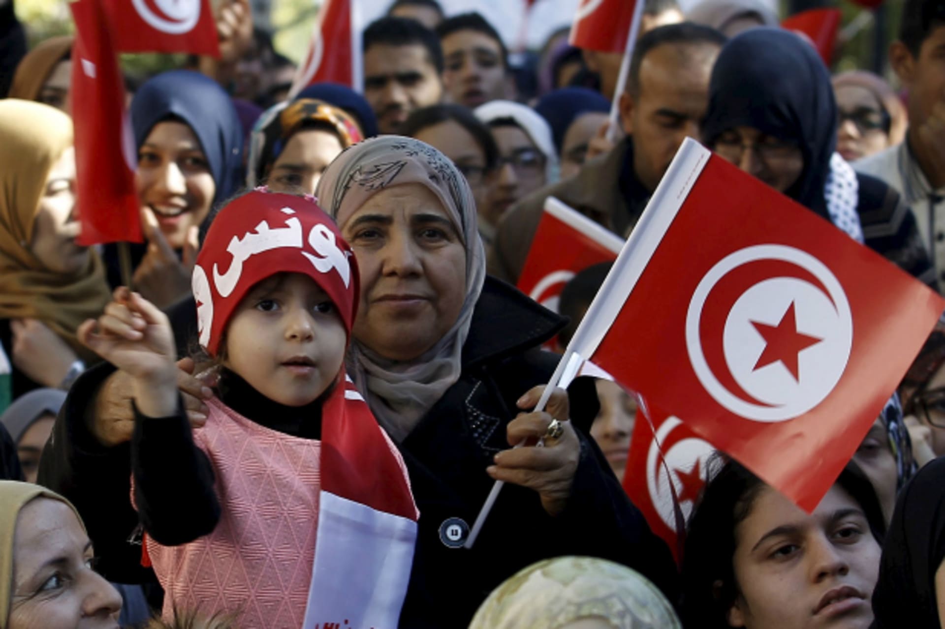 <p>A girl waves a Tunisian flags during celebrations marking the fifth anniversary of Tunisia’s 2011 revolution, in Habib Bourguiba Avenue in Tunis, Tunisia (Zoubeir Souissi/Reuters).</p>
