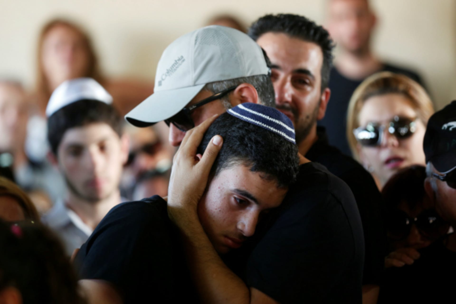 <p>Relatives and friends mourn during the funeral of Ido Ben Ari, one of four Israelis who was killed in an Palestinian shooting attack in Tel Aviv, at a cemetery in Yavne, Israel (Ronen Zvulun/Reuters).</p>

