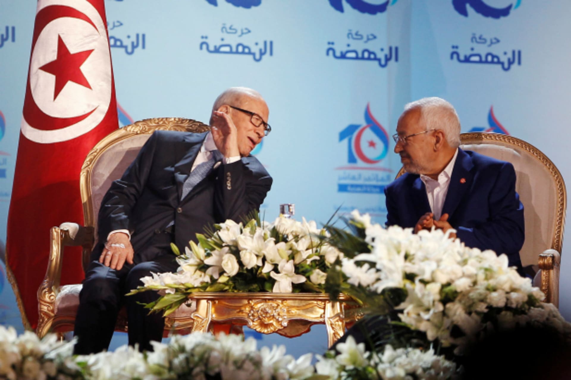 <p>2016Tunisian President Beji Caid Essebsi (L), talks with Rached Ghannouchi, leader of the Islamist Ennahda movement, during the congress of the Ennahda Movement in Tunis, Tunisia (Zoubeir Souissi/Reuters).</p>
