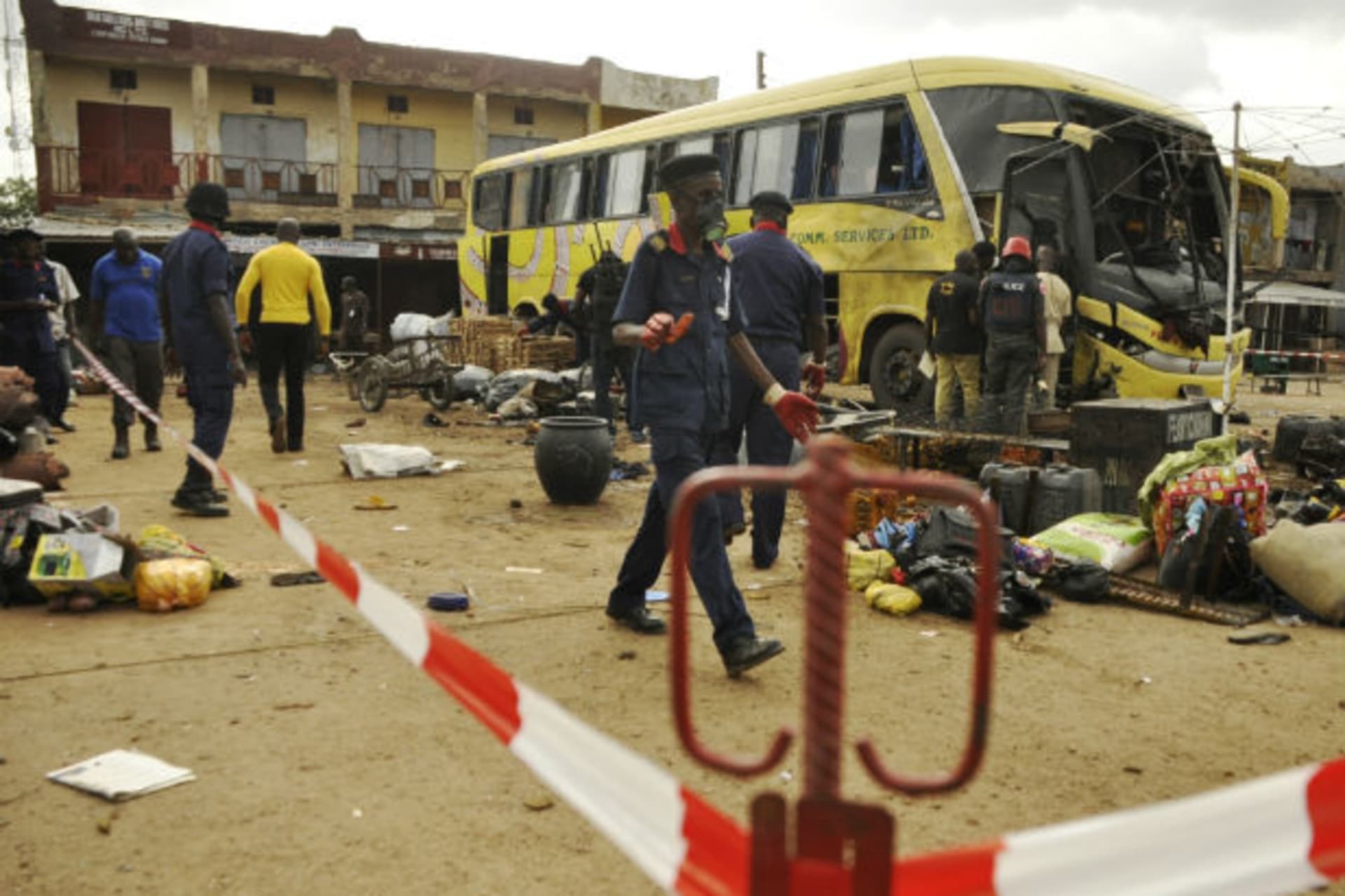 Security personnel comb the scene of a bomb explosion at the Sabon Gari bus park in Kano, July 24, 2014. (Stringer/Courtesy Reuters)