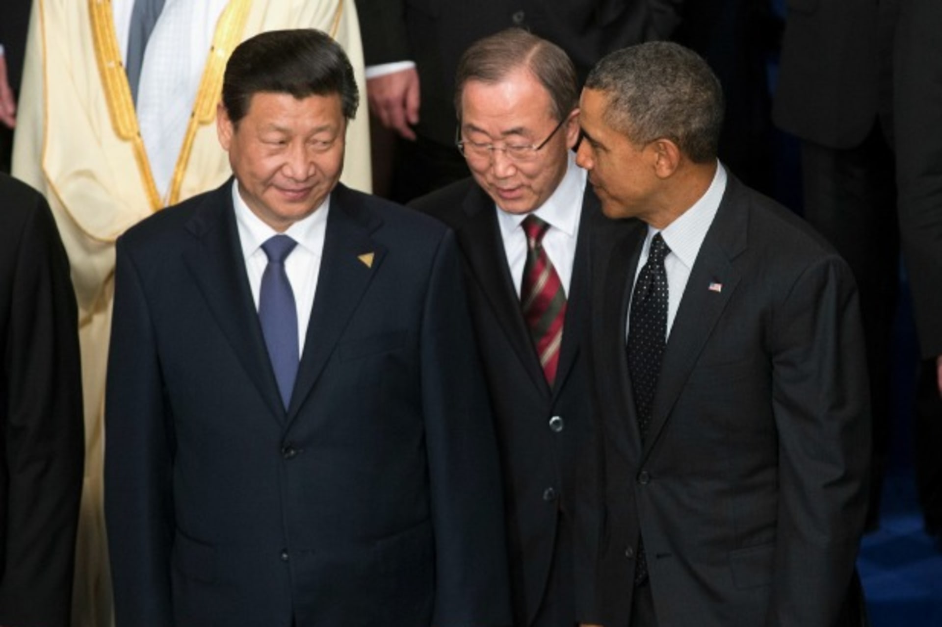 <p>U.S. President Barack Obama, U.N. Secretary-General Ban Ki-moon and China’s President Xi Jinping talk during a family photo at the Nuclear Security Summit in The Hague March 25, 2014. (Doug Mills/Courtesy Reuters)</p>

