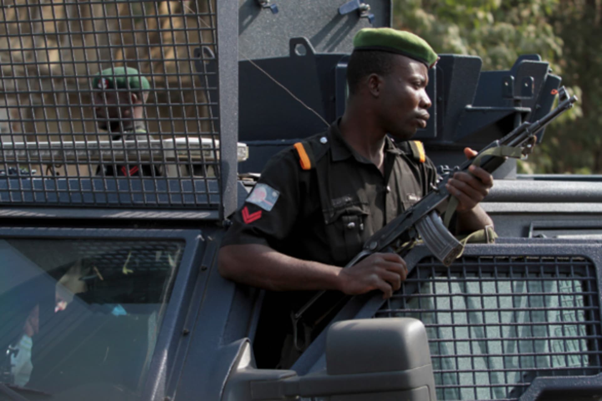 A police officer keeps watch during a protest against the elimination of a popular fuel subsidy that has doubled the price of petrol, in Nigeria's capital Abuja January 9, 2012. r armed