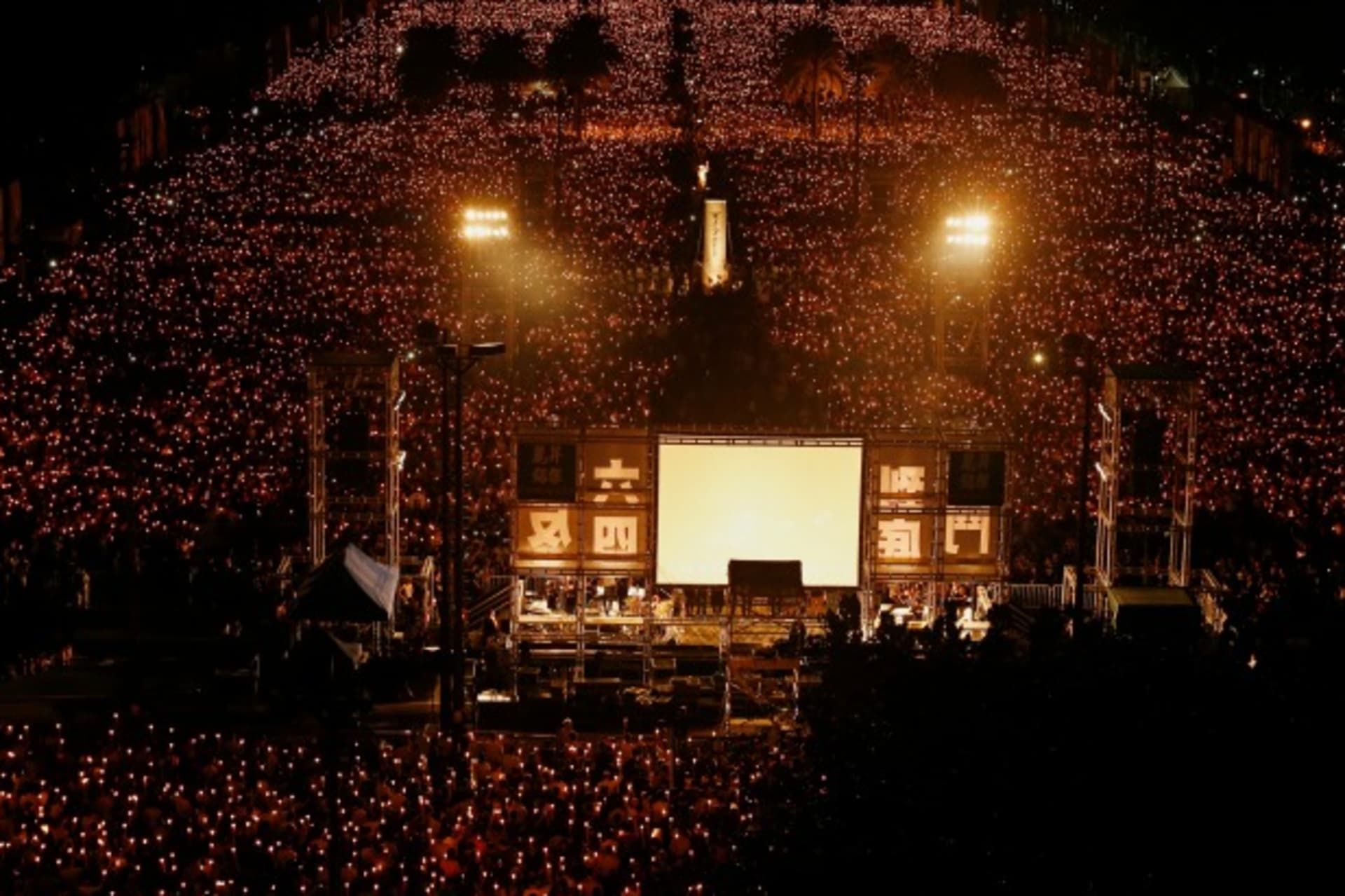 <p>Tens of thousands of people take part in a candlelight vigil at Hong Kong’s Victoria Park on June 4, 2014, to mark the 25th an…ry of the military crackdown on the pro-democracy movement at Beijing’s Tiananmen Square in 1989. (Bobby Yip/Courtesy Reuters)</p>
