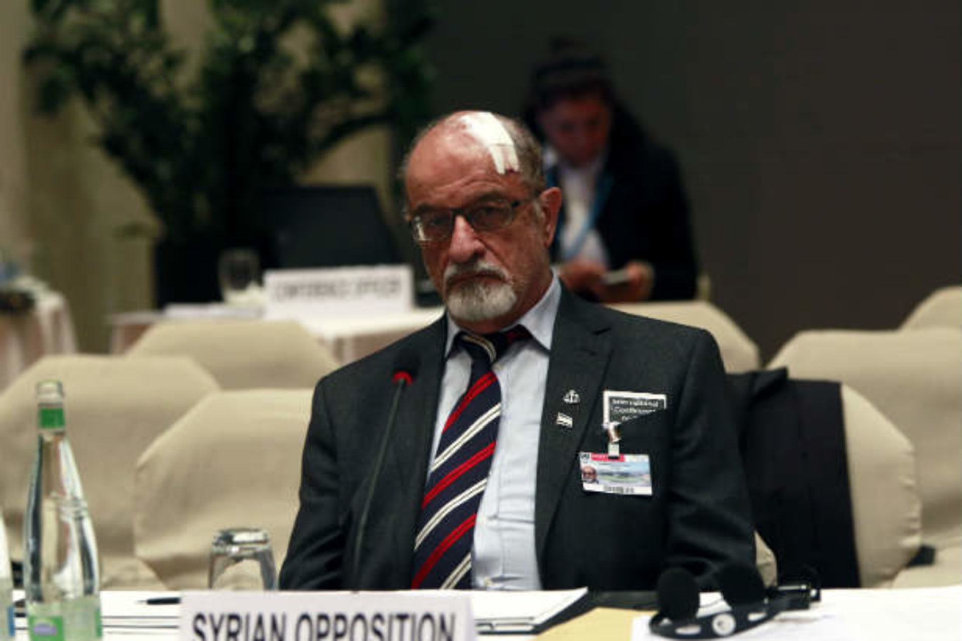 Senior Syrian opposition member Haitham al-Maleh sits alone during the second session of the Geneva-2 peace conference in Montreux January 22, 2014 (Saidi/Courtesy Reuters).